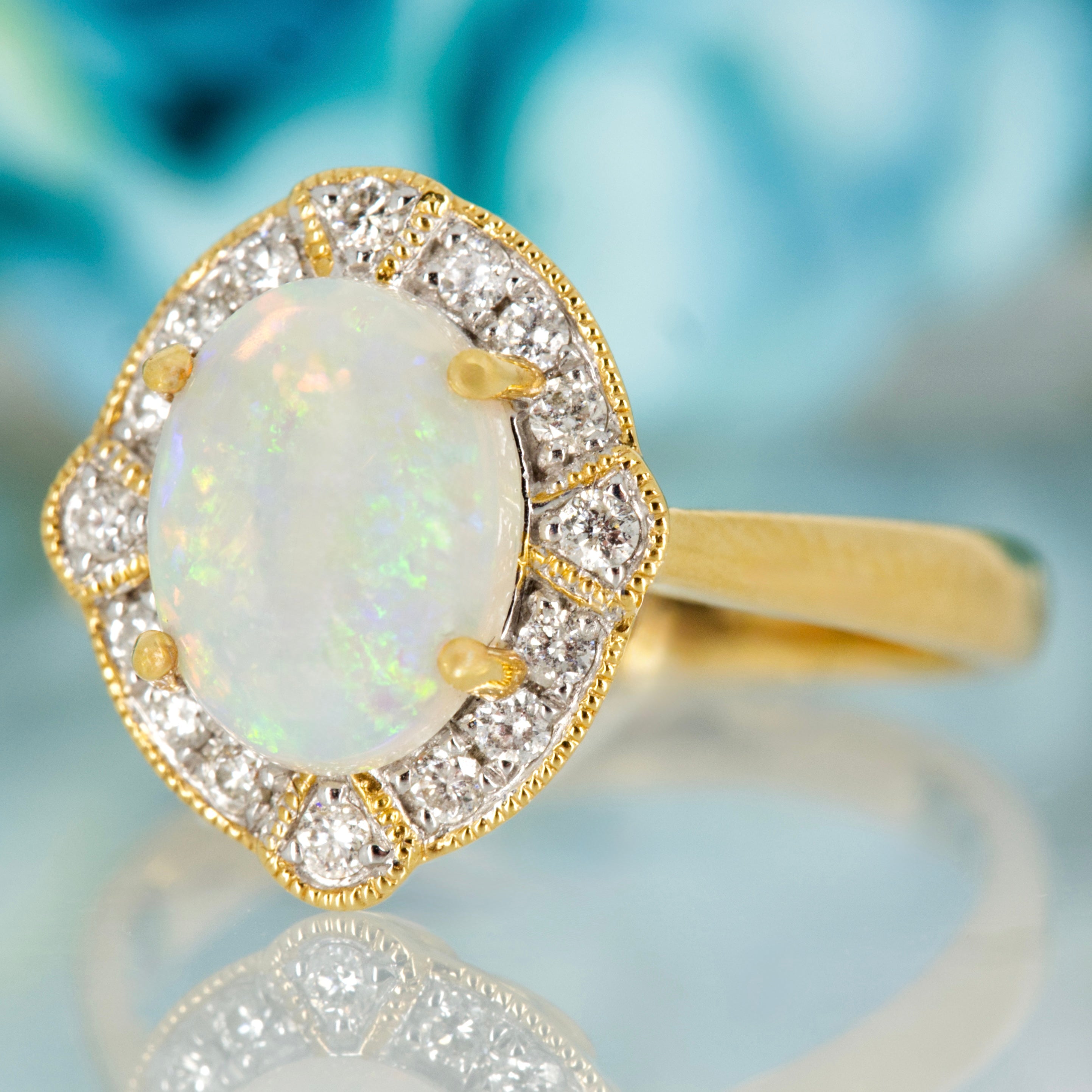 18ct Yellow Gold Oval Shaped Opal & Round Brilliant Cut Diamond Cluster Ring