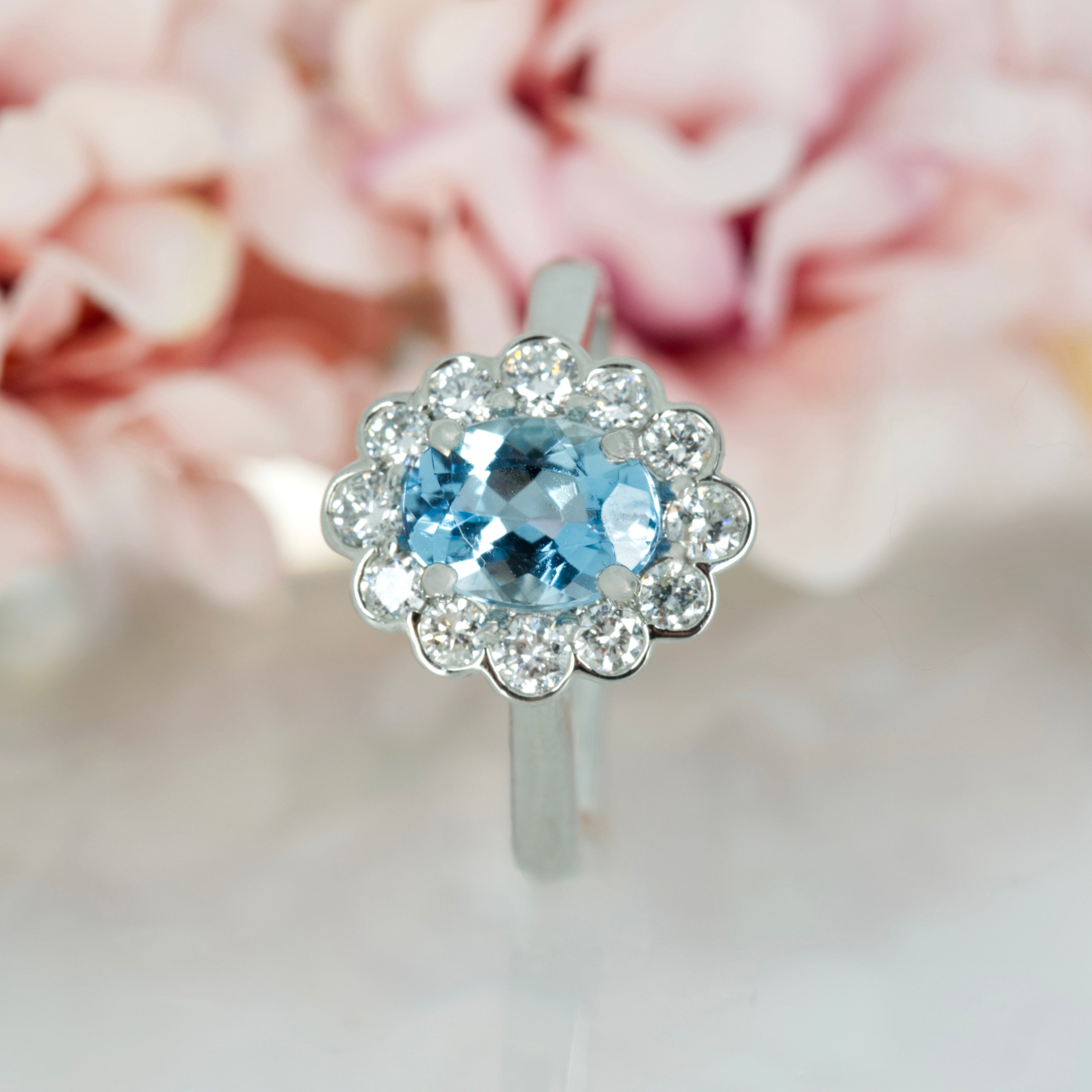 Platinum Oval Cut Aquamarine & Round Brilliant Cut Diamond Cluster Ring