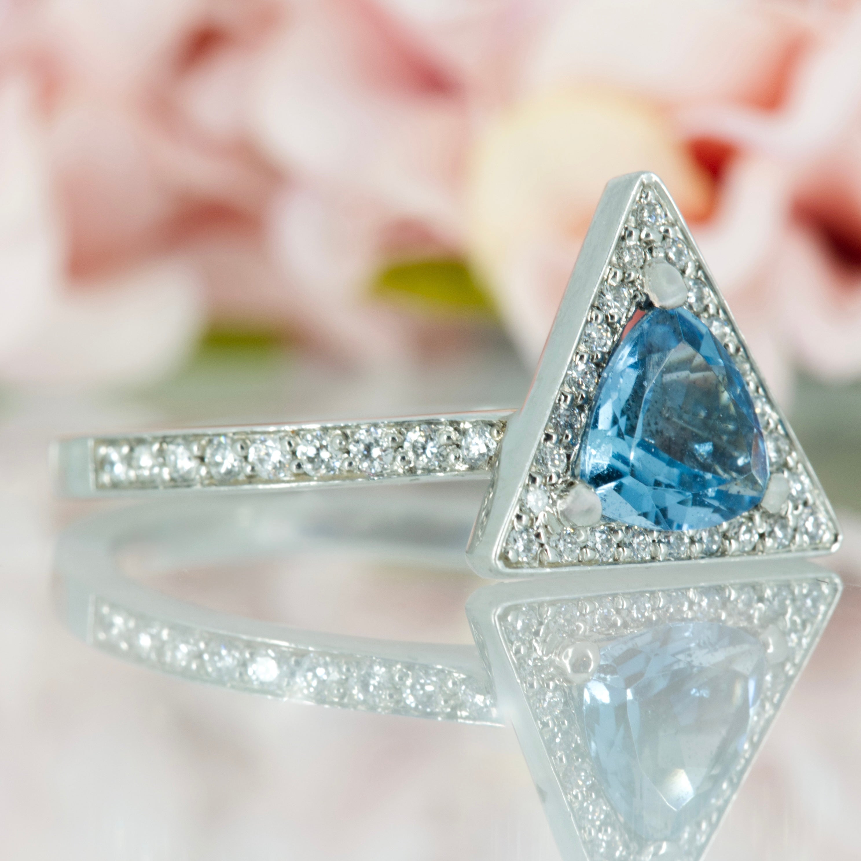 Platinum Trilliant Cut Aquamarine & Round Brilliant Cut Diamond Halo Cluster Ring