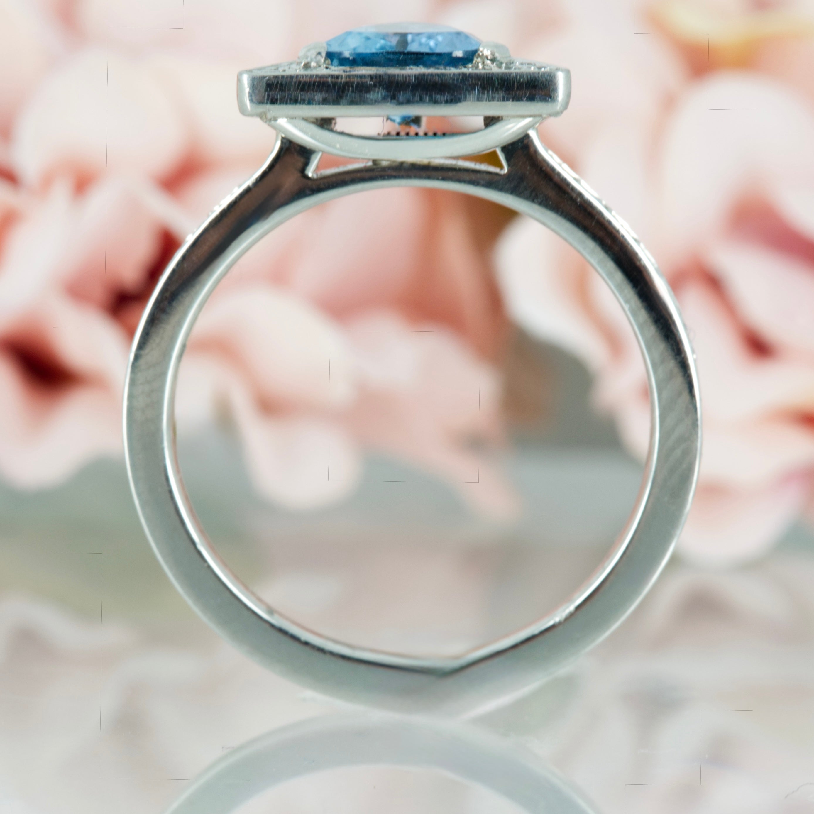 Platinum Trilliant Cut Aquamarine & Round Brilliant Cut Diamond Halo Cluster Ring