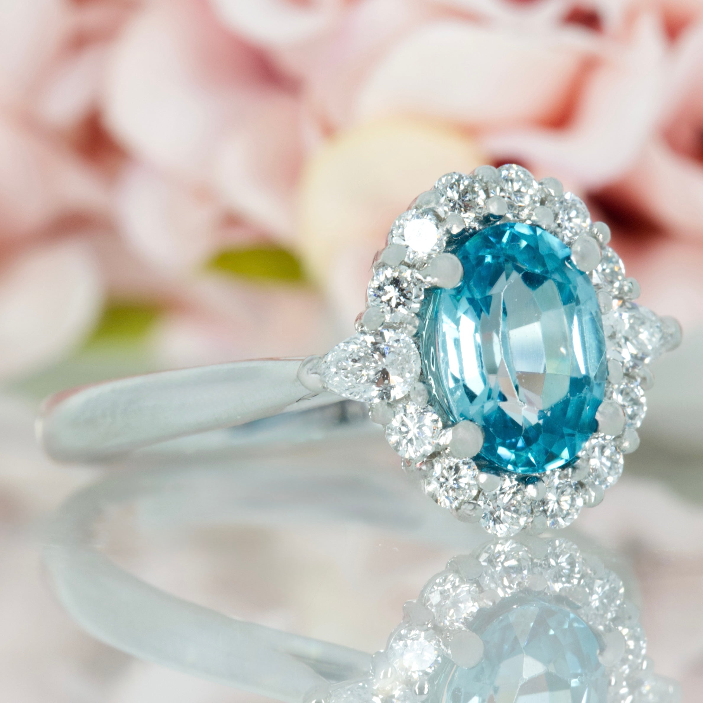 Platinum Oval Cut Blue Zircon & Pear and Round Brilliant Cut Diamond Cluster Ring