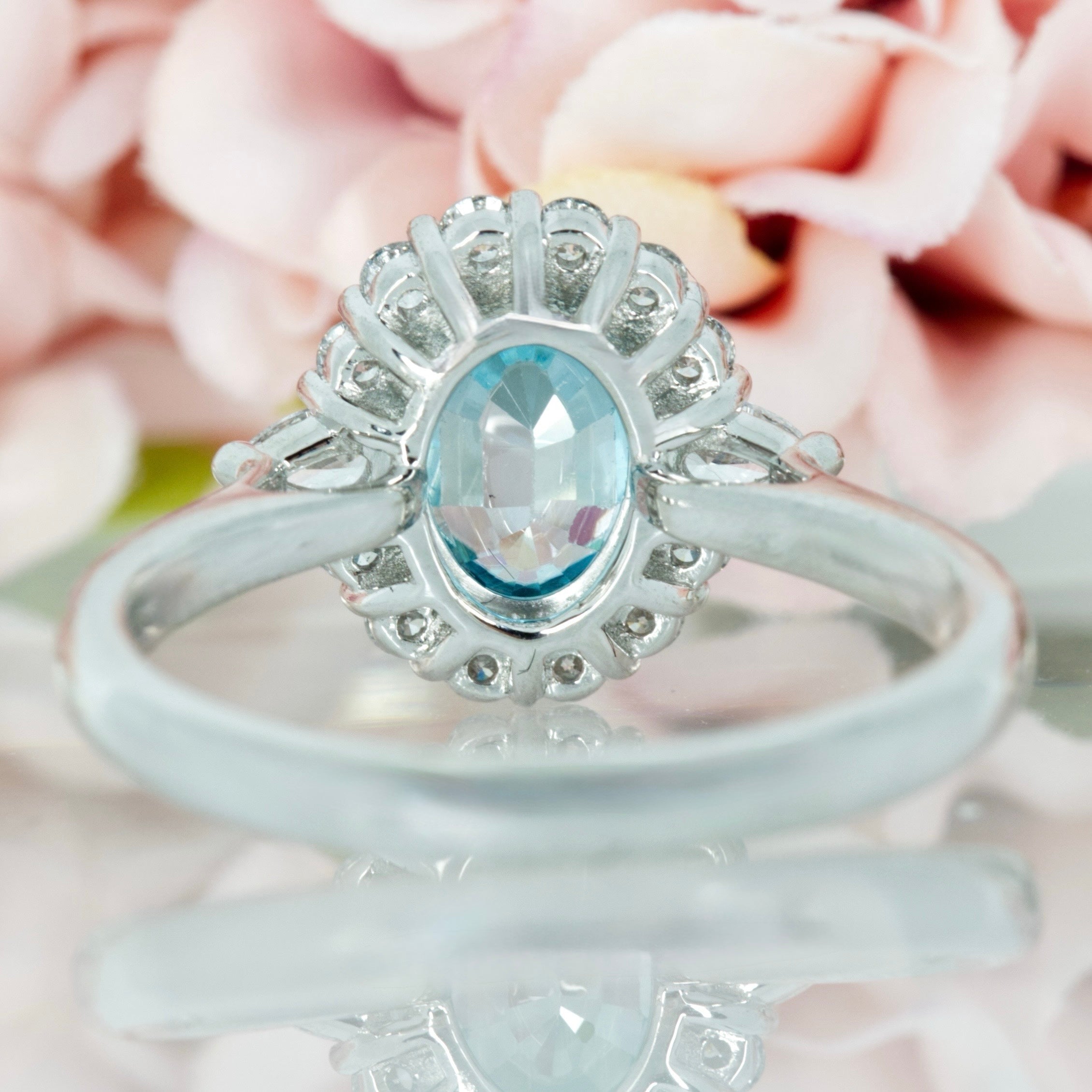 Platinum Oval Cut Blue Zircon & Pear and Round Brilliant Cut Diamond Cluster Ring