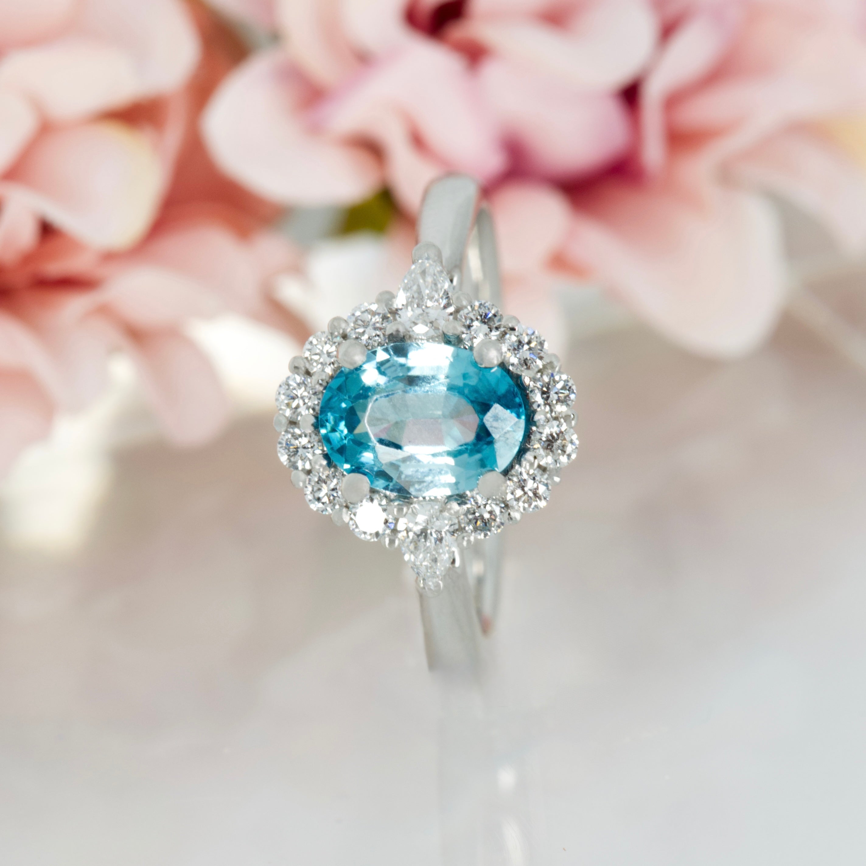 Platinum Oval Cut Blue Zircon & Pear and Round Brilliant Cut Diamond Cluster Ring