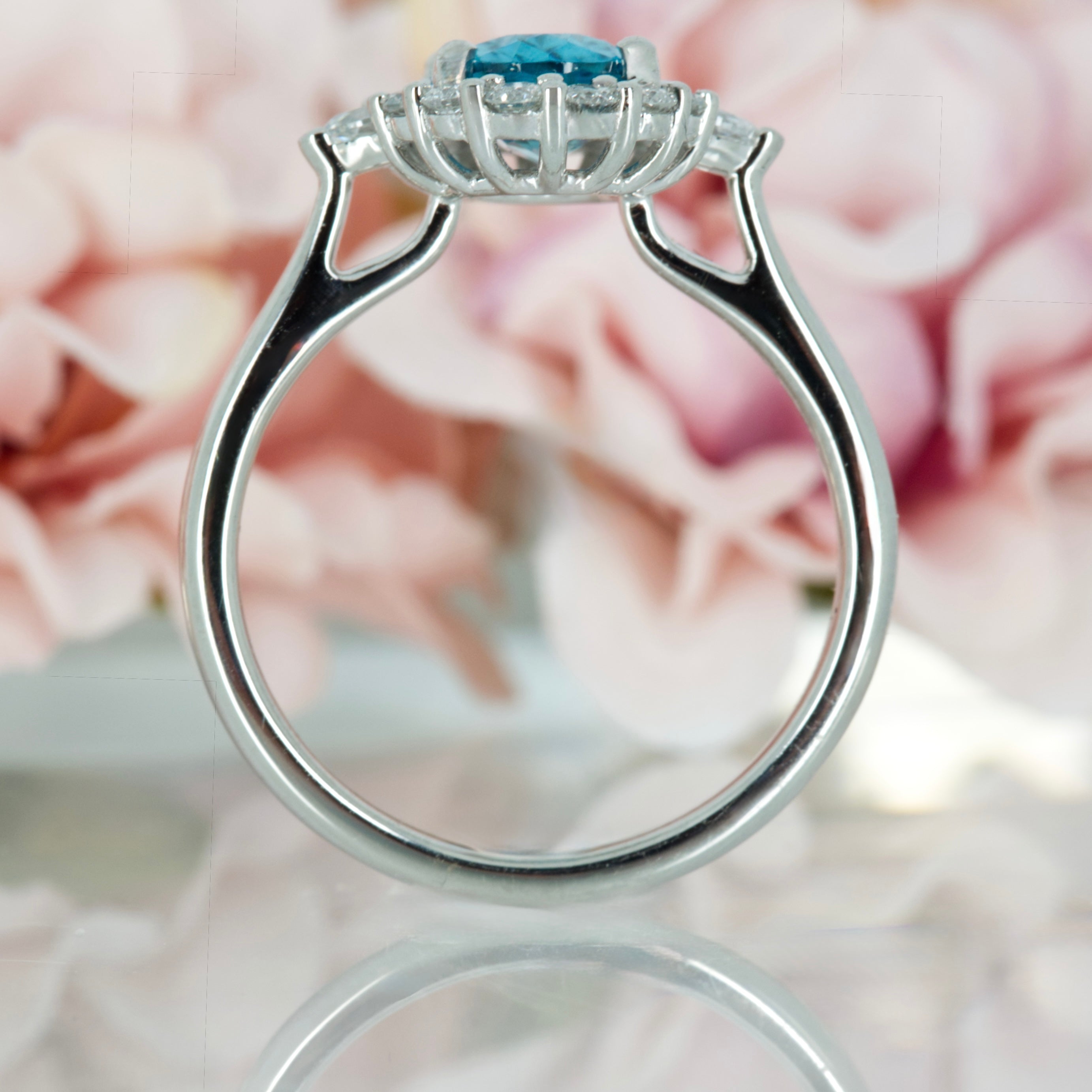 Platinum Oval Cut Blue Zircon & Pear and Round Brilliant Cut Diamond Cluster Ring