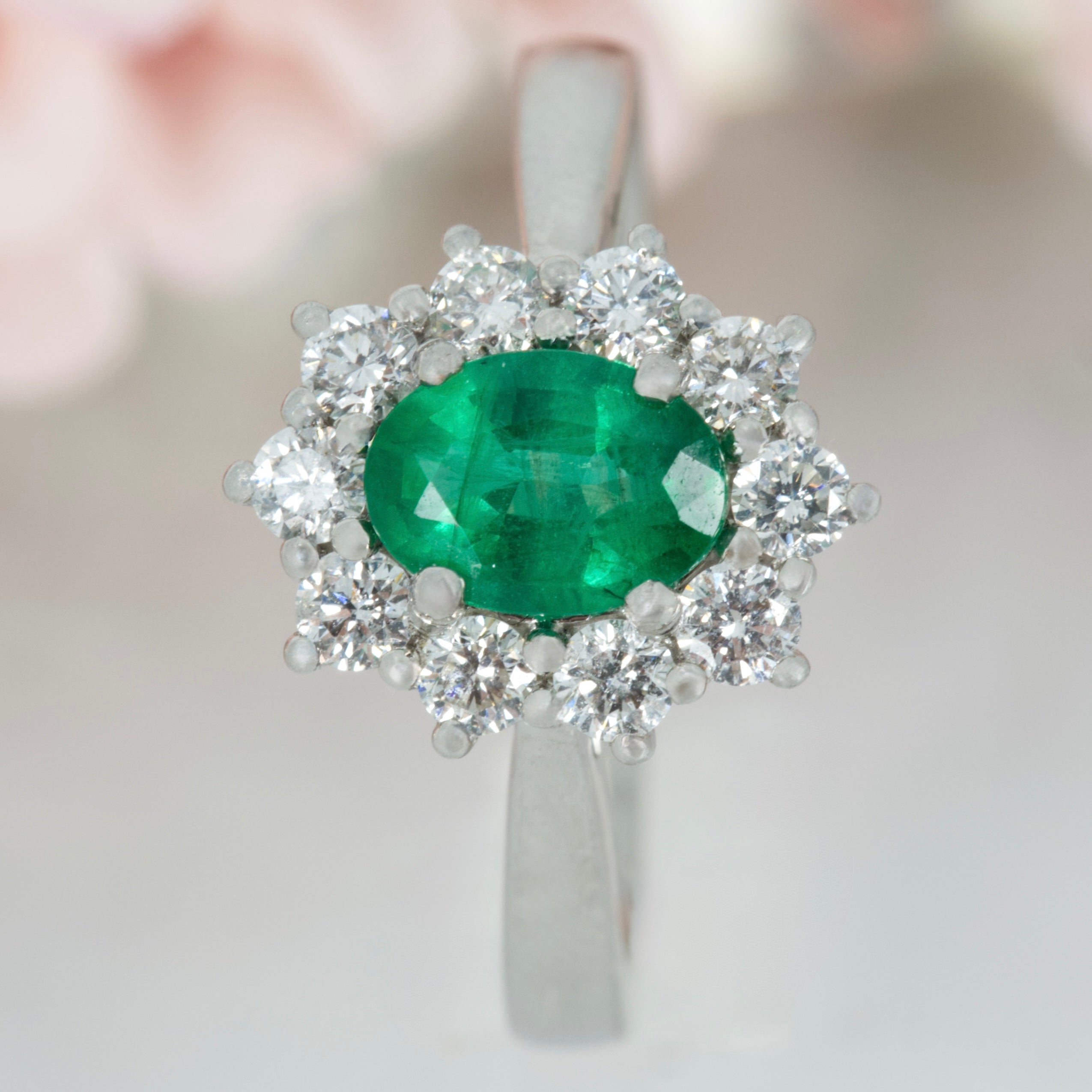 Platinum Oval Cut Emerald & Round Brilliant Cut Diamond Cluster Ring
