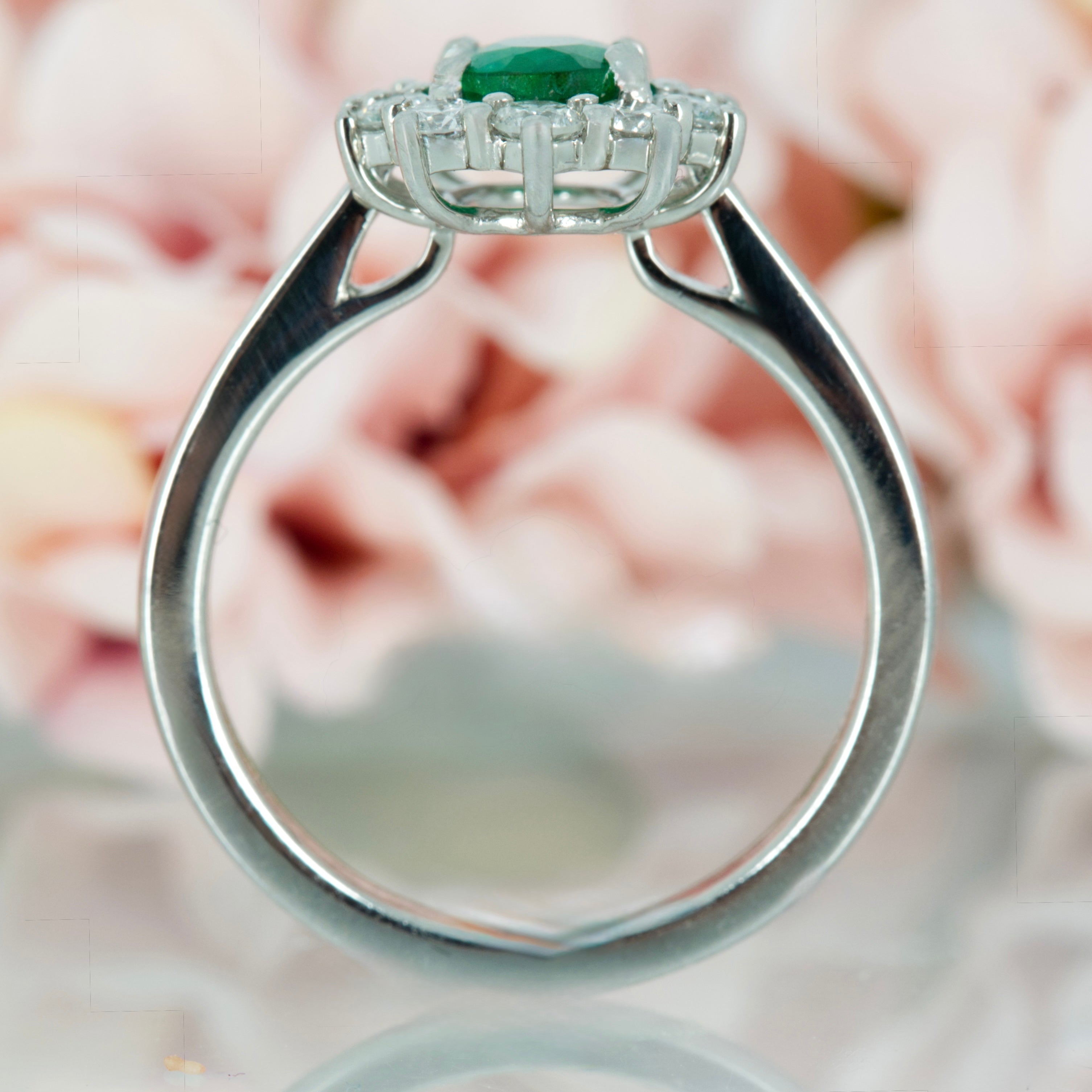 Platinum Oval Cut Emerald & Round Brilliant Cut Diamond Cluster Ring