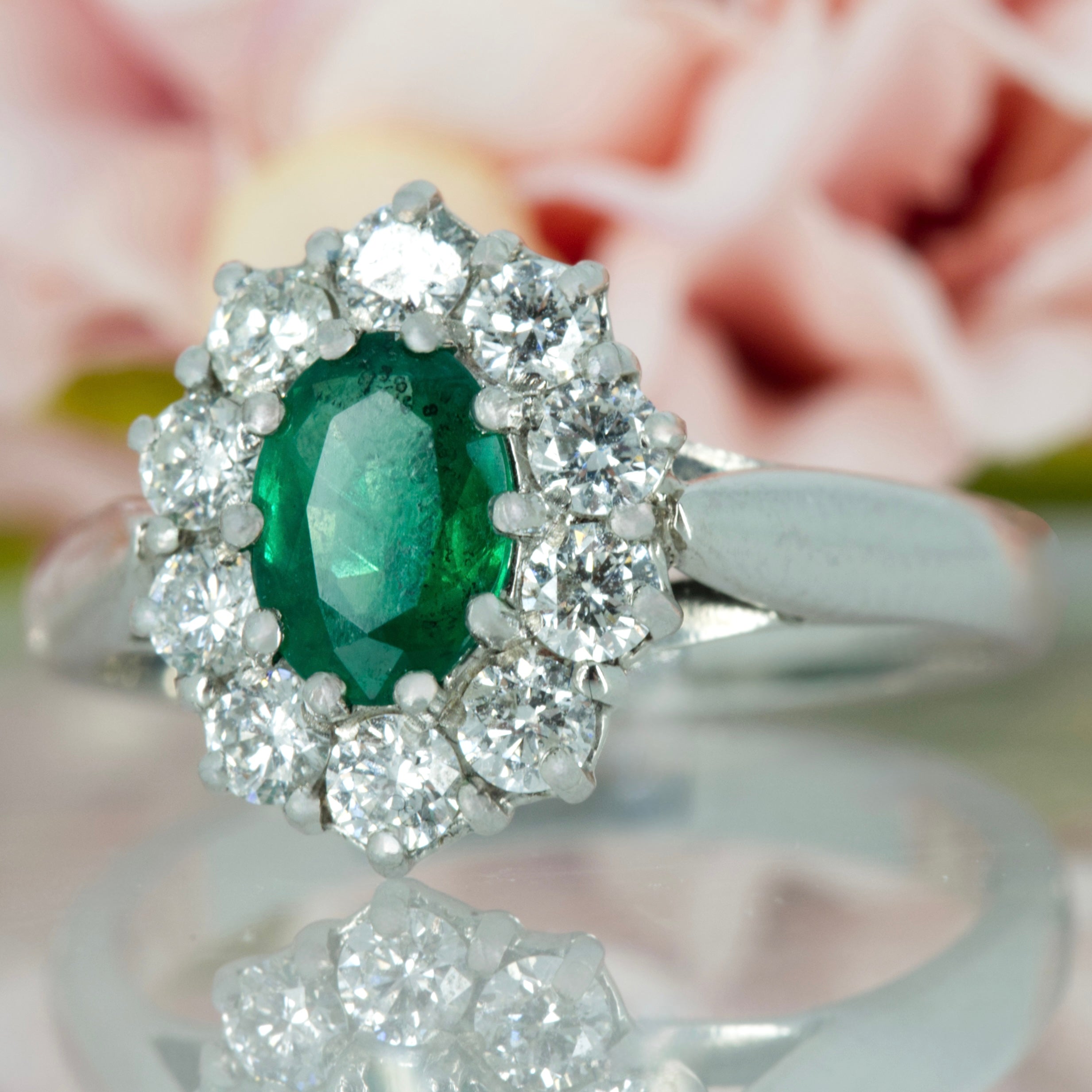 Platinum Oval Cut Emerald & Round Brilliant Cut Diamond Cluster Ring