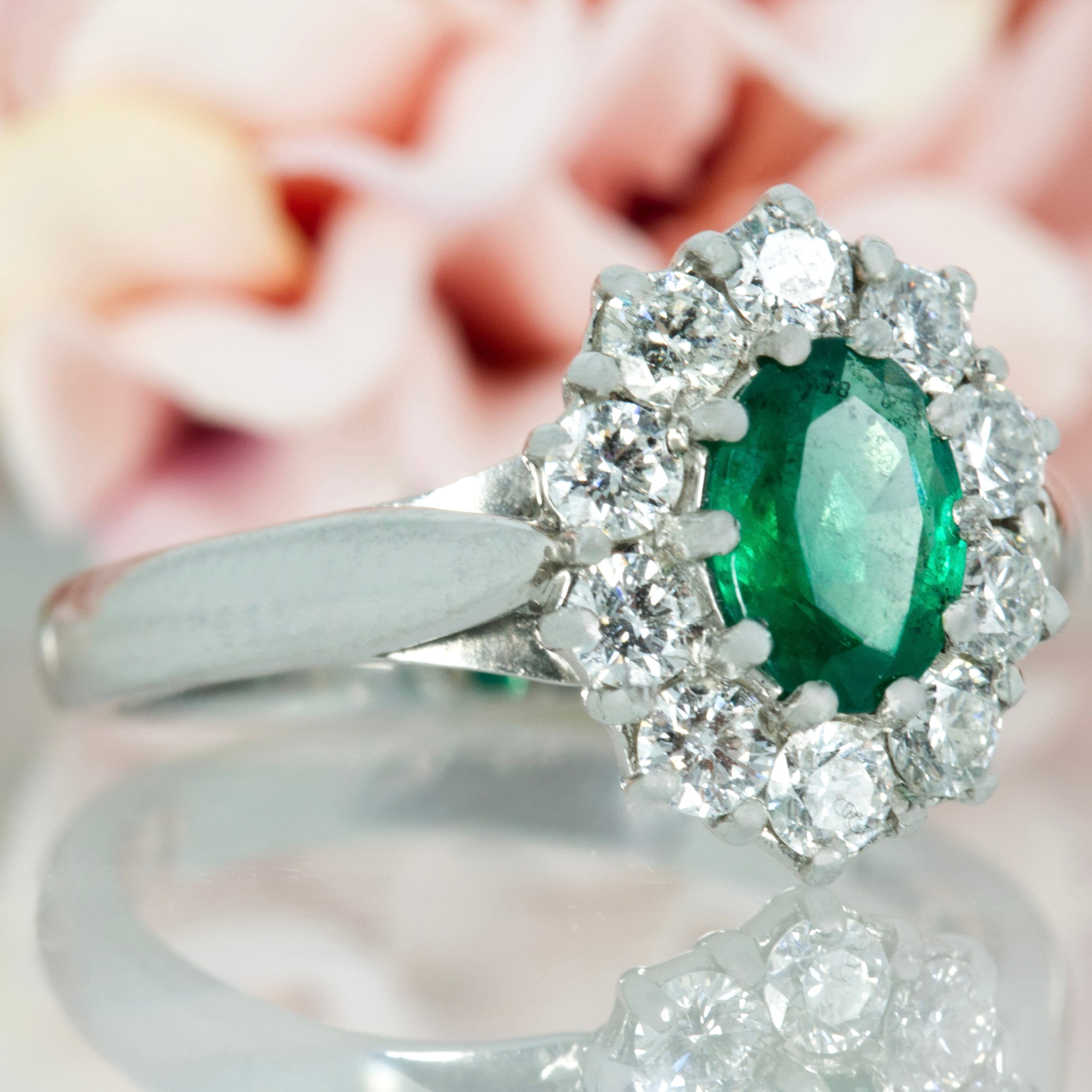 Platinum Oval Cut Emerald & Round Brilliant Cut Diamond Cluster Ring