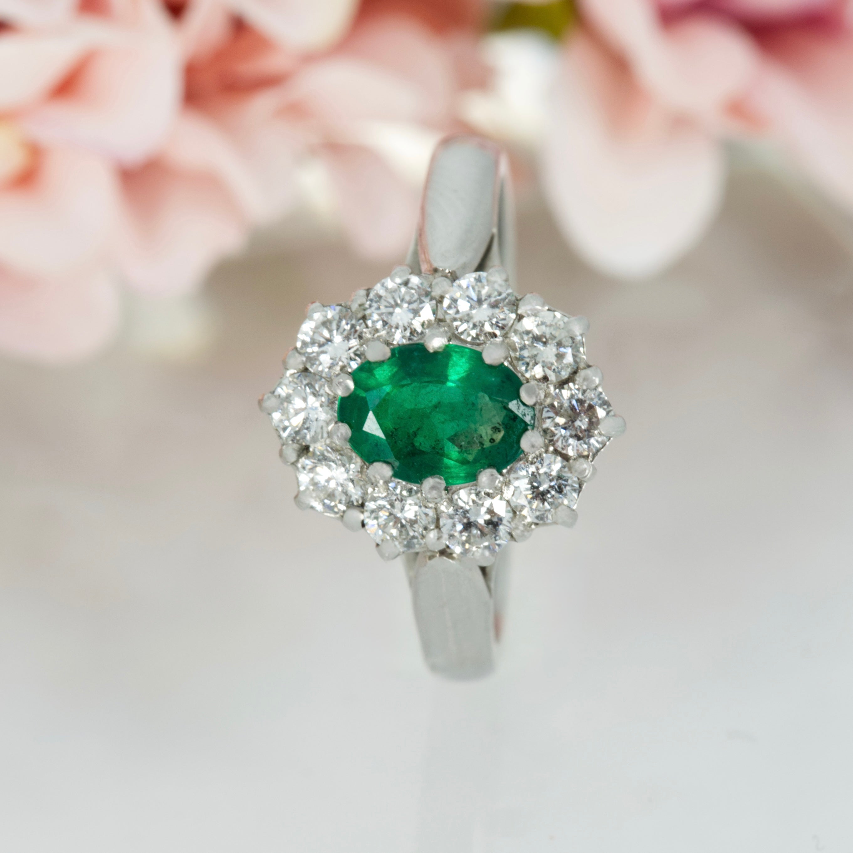Platinum Oval Cut Emerald & Round Brilliant Cut Diamond Cluster Ring