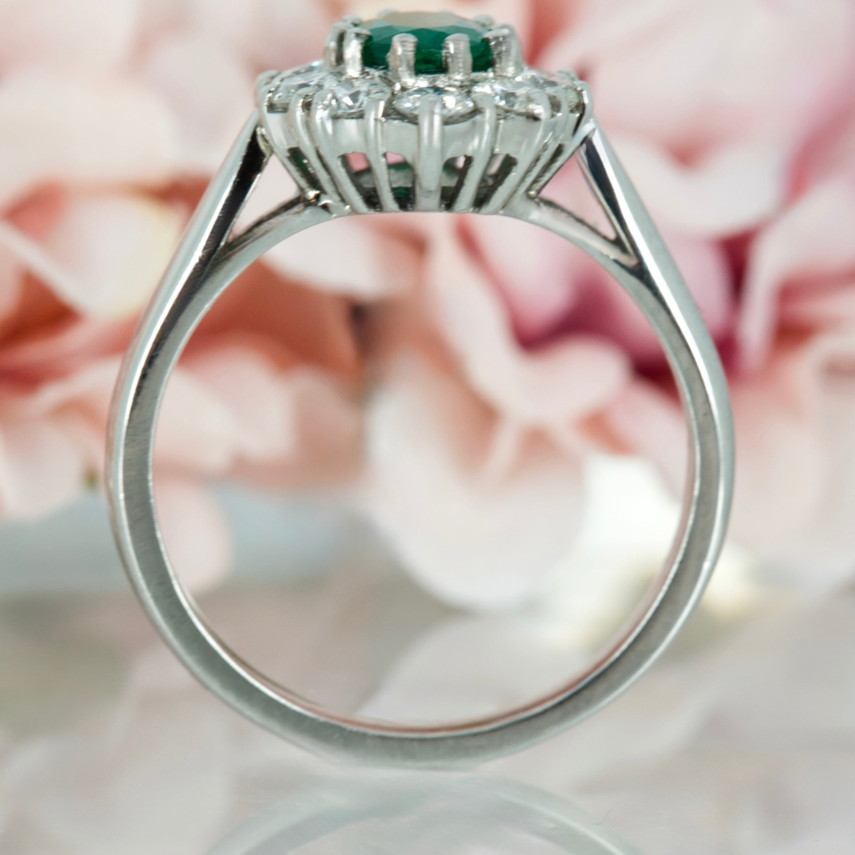 Platinum Oval Cut Emerald & Round Brilliant Cut Diamond Cluster Ring