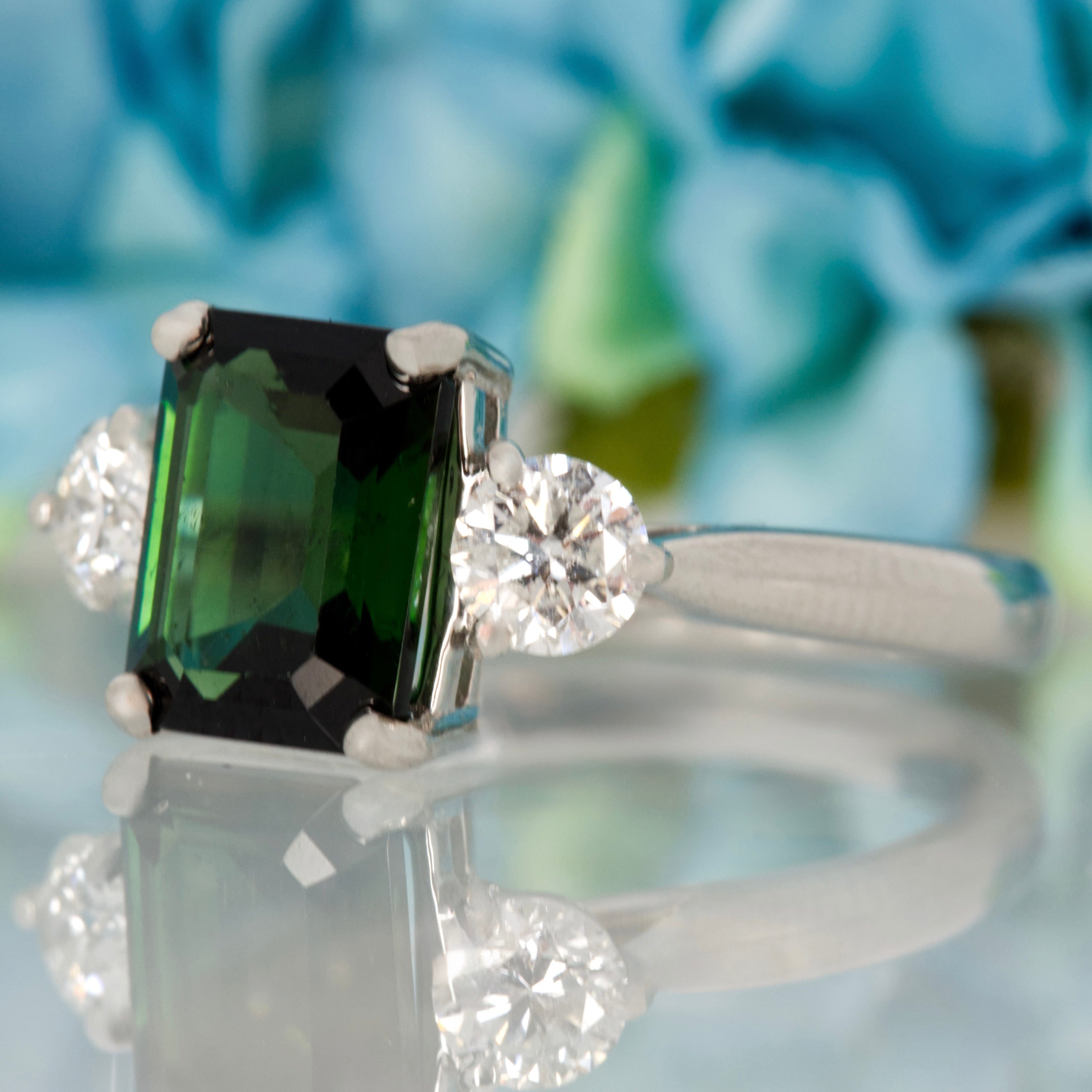 Platinum Octagonal Cut Green Tourmaline & Round Brilliant Cut Diamond Trilogy Ring