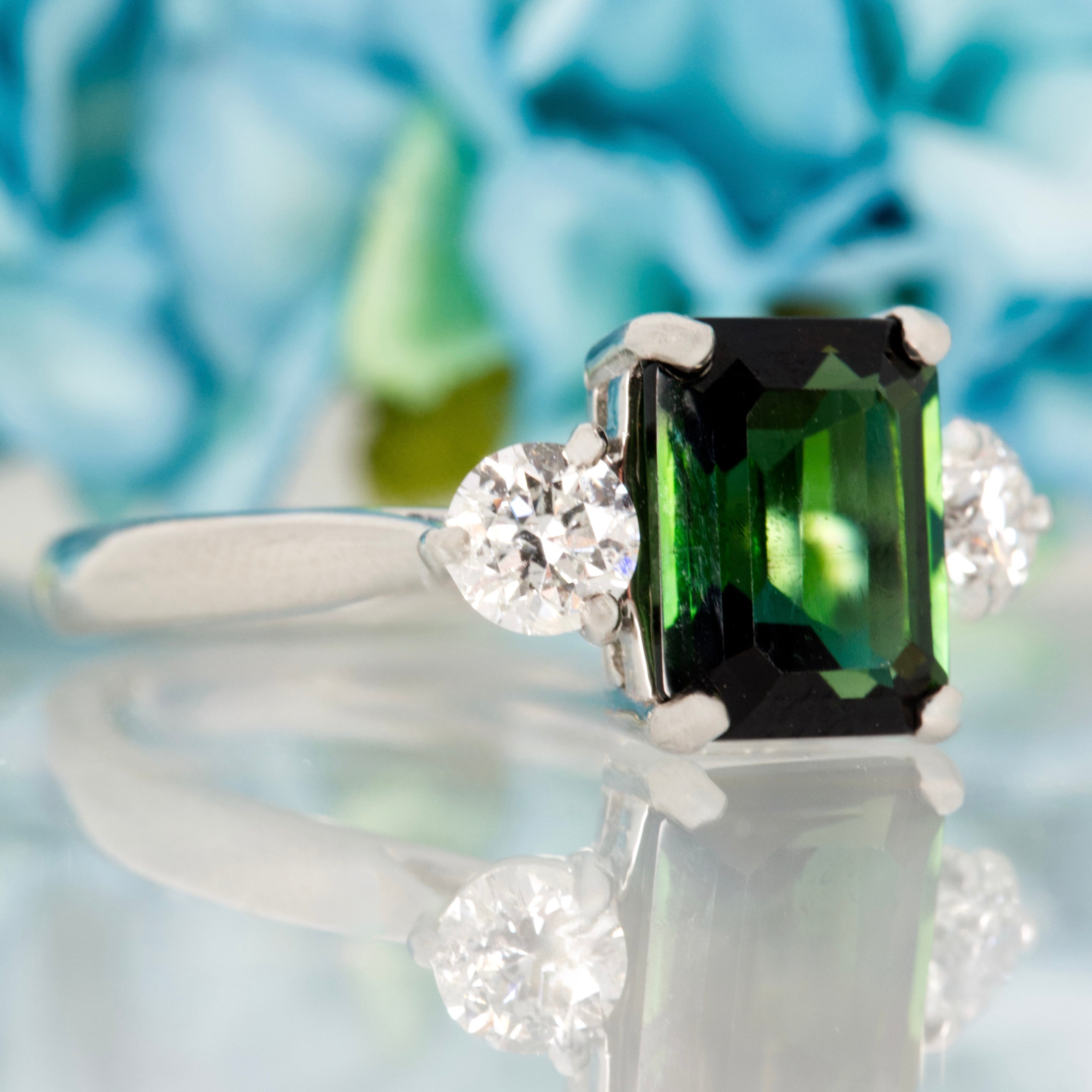 Platinum Octagonal Cut Green Tourmaline & Round Brilliant Cut Diamond Trilogy Ring