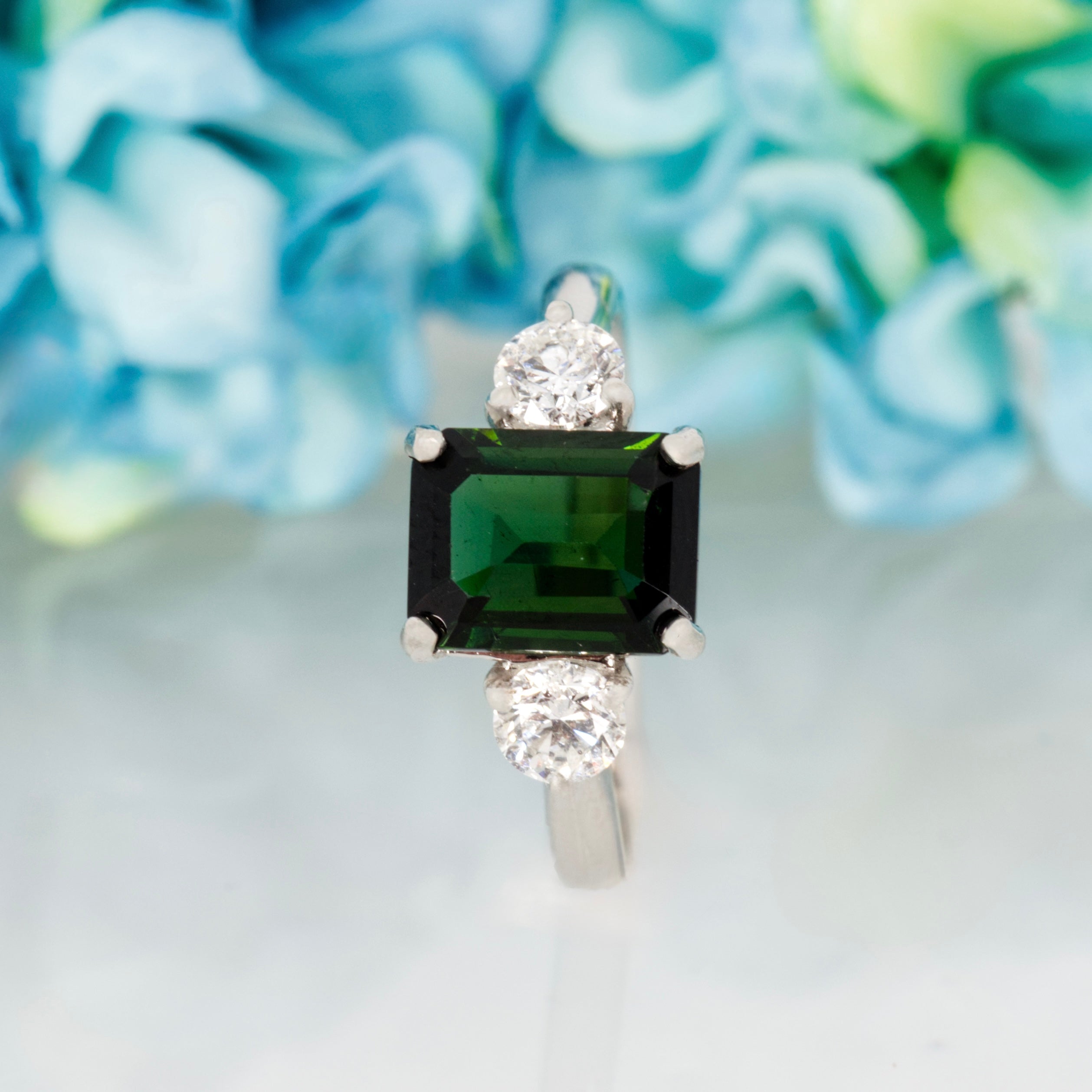 Platinum Octagonal Cut Green Tourmaline & Round Brilliant Cut Diamond Trilogy Ring