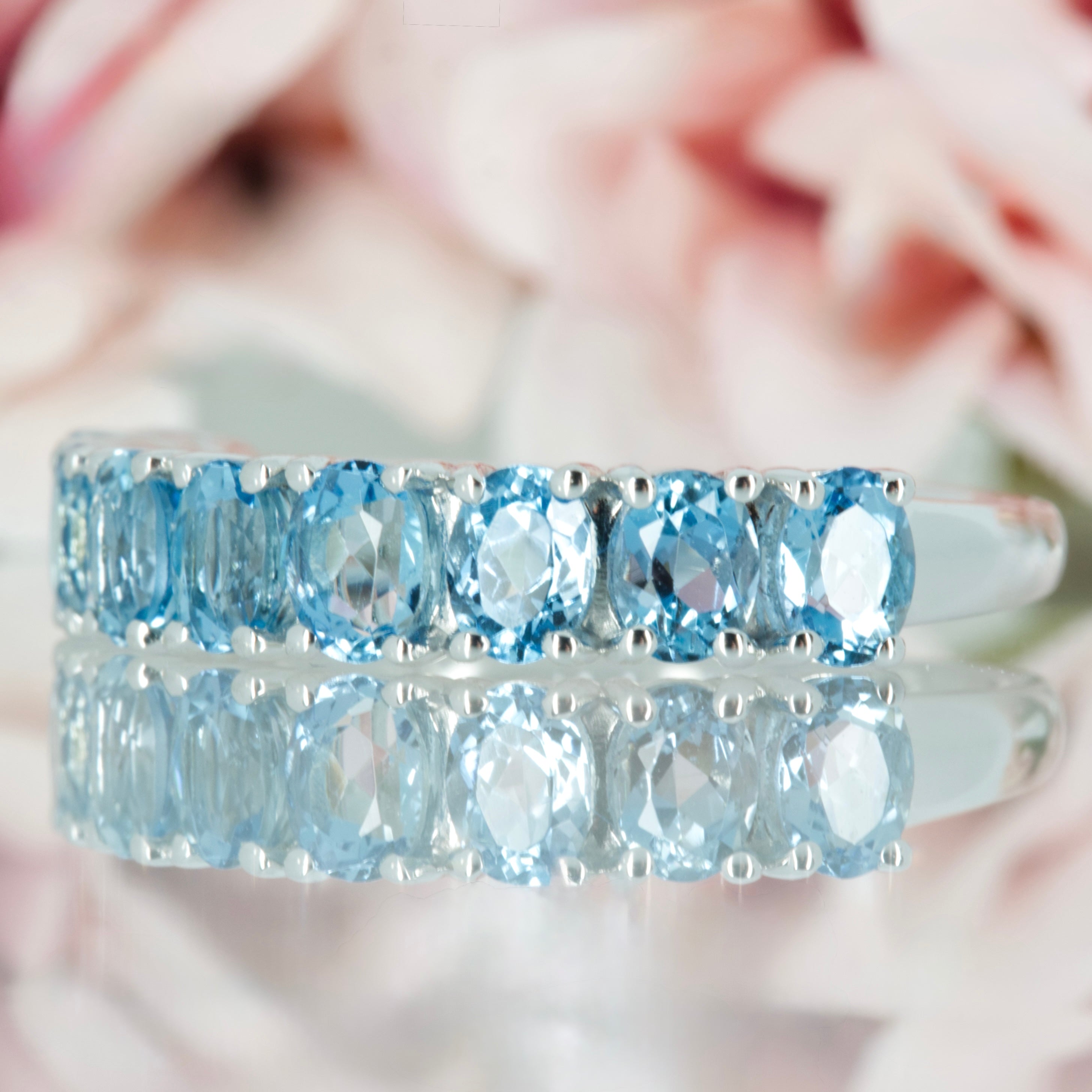 9ct White Gold Oval Cut Aquamarine Nine Stone Half Eternity Ring