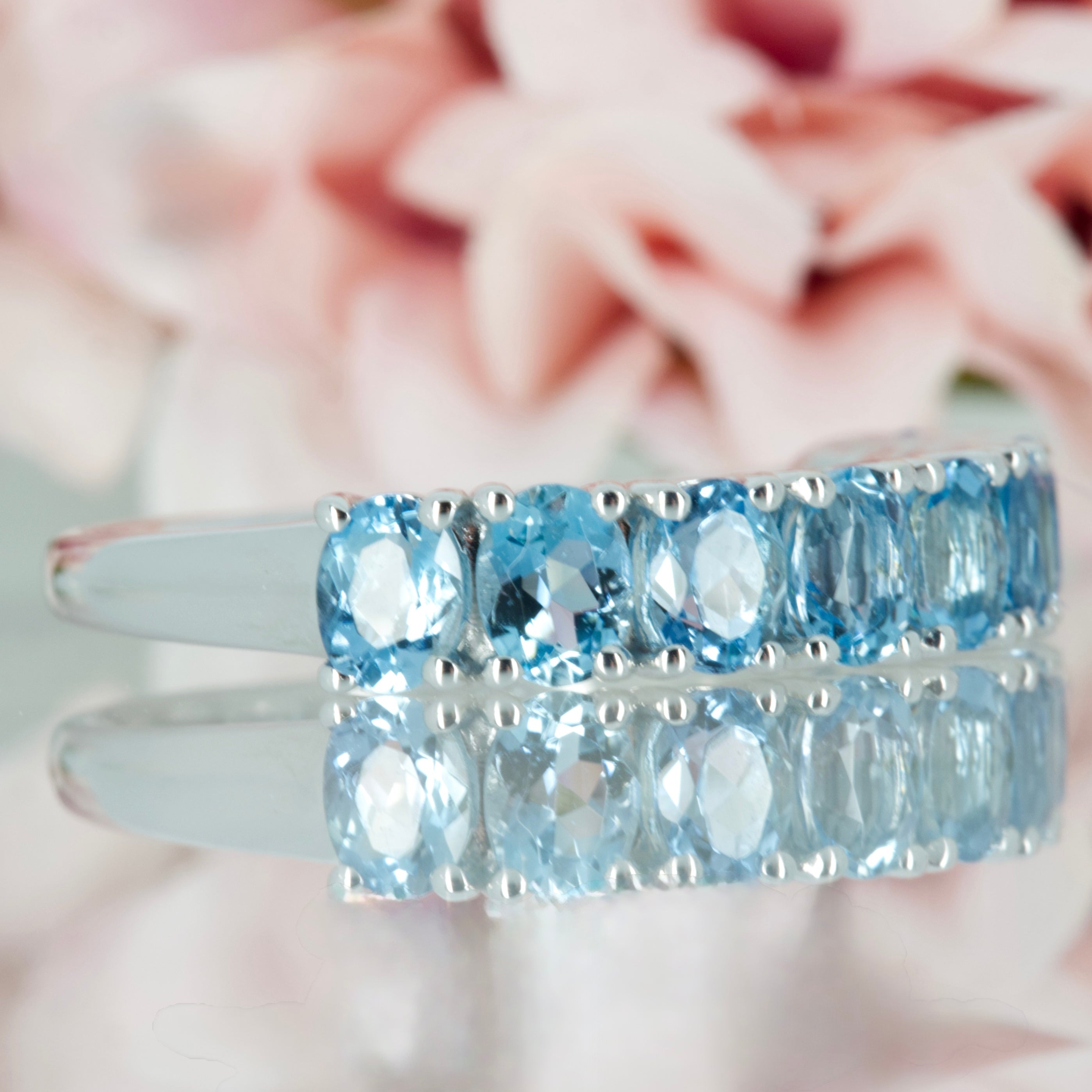 9ct White Gold Oval Cut Aquamarine Nine Stone Half Eternity Ring
