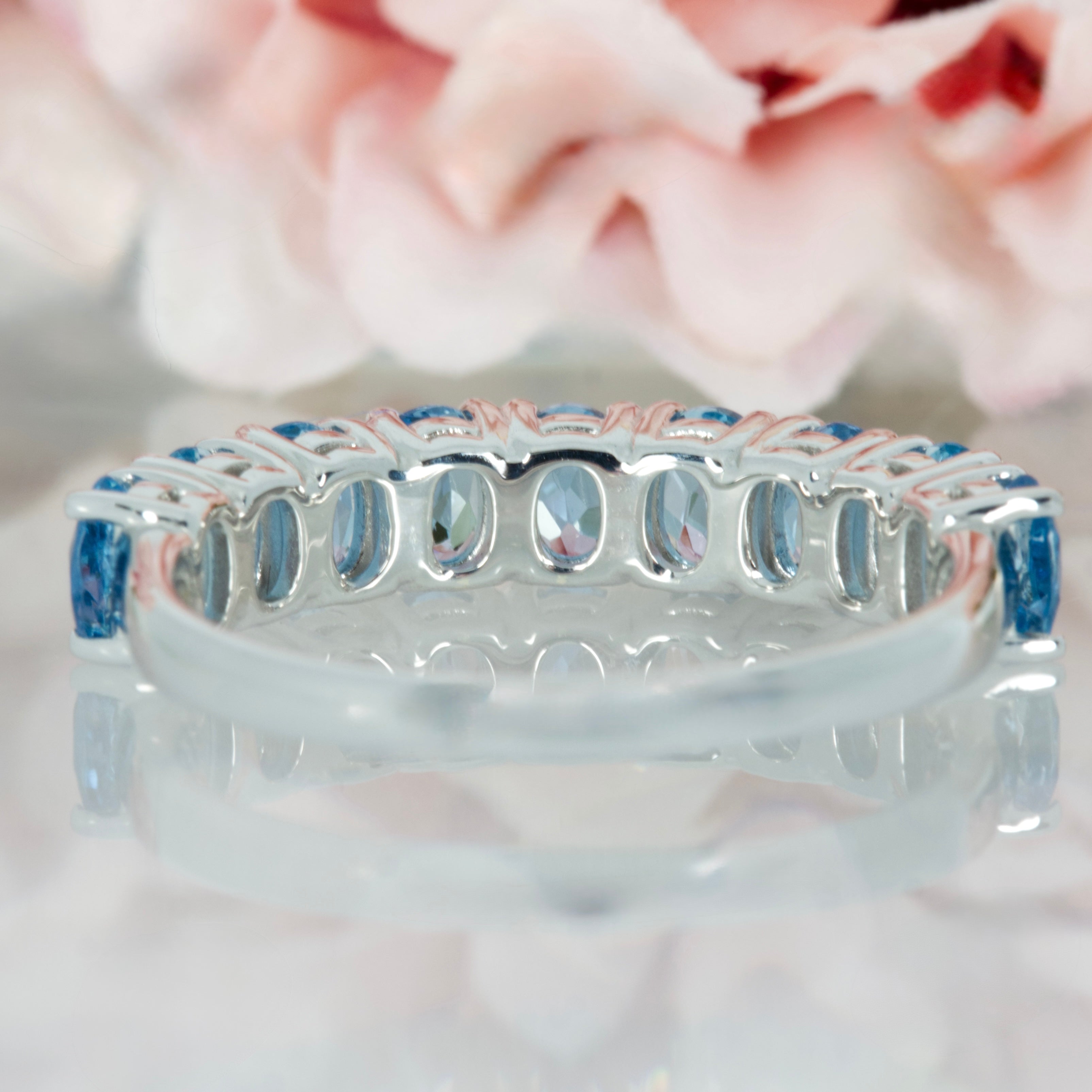 9ct White Gold Oval Cut Aquamarine Nine Stone Half Eternity Ring