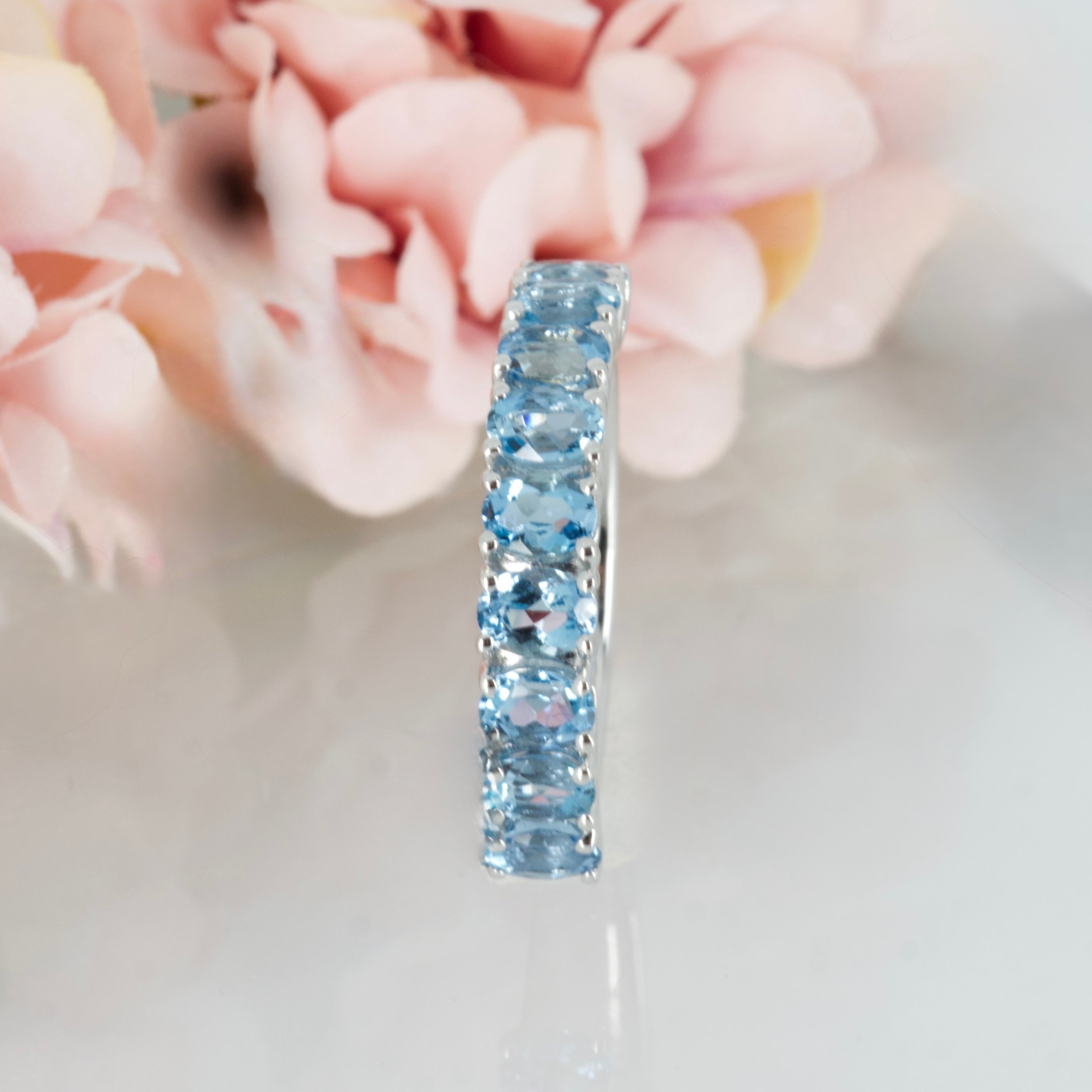 9ct White Gold Oval Cut Aquamarine Nine Stone Half Eternity Ring
