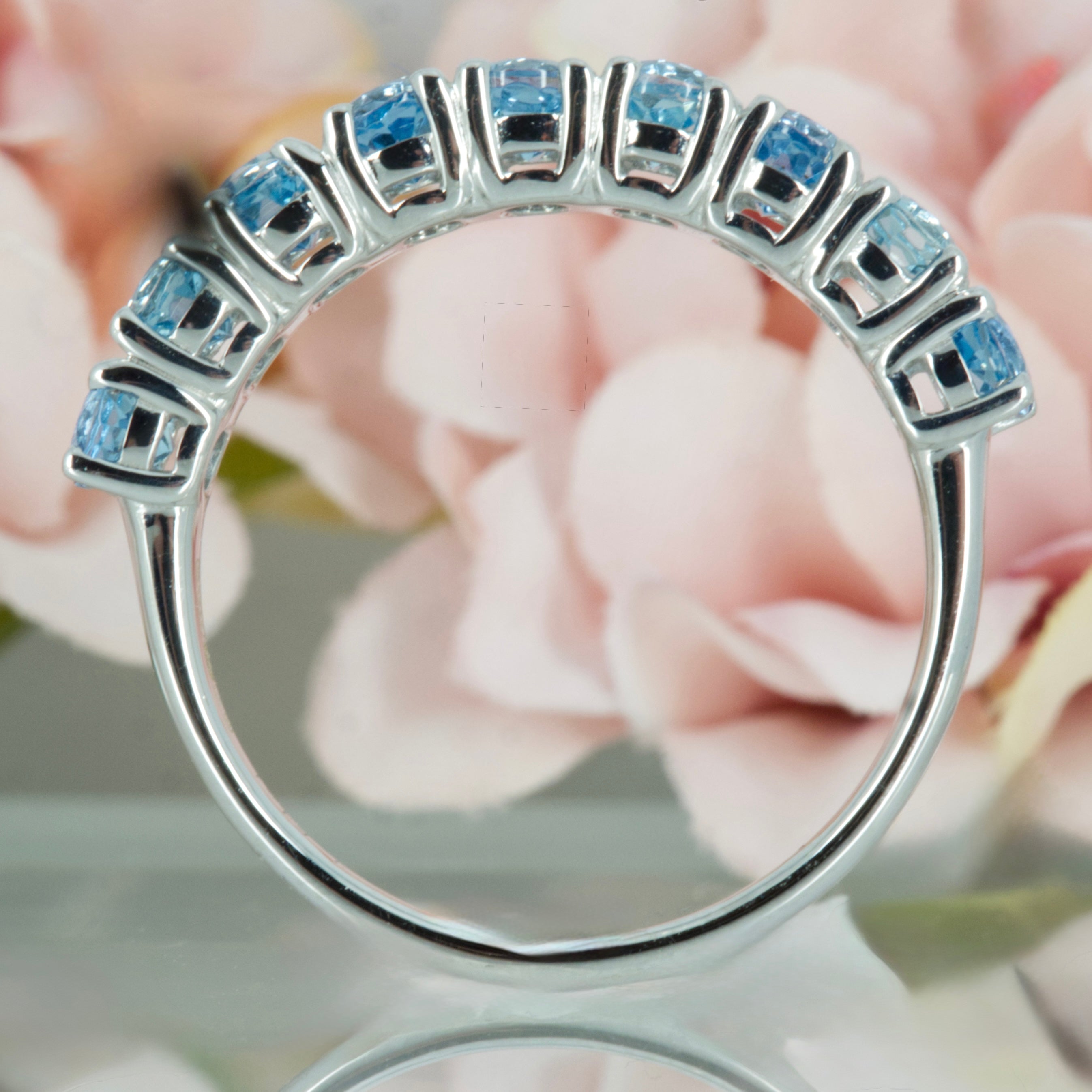 9ct White Gold Oval Cut Aquamarine Nine Stone Half Eternity Ring