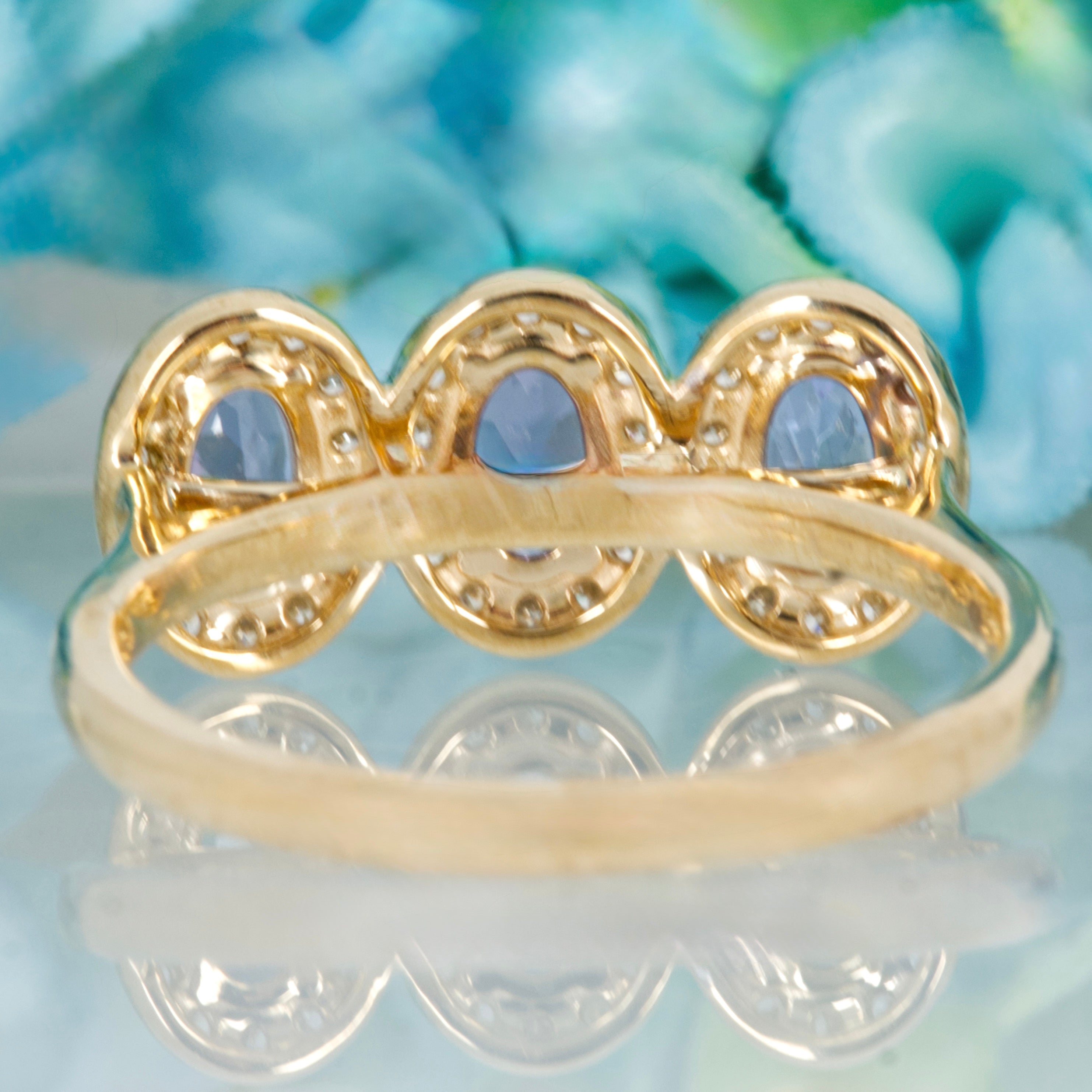 9ct Yellow Gold Oval Cut Tanzanite & Round Brilliant Cut Diamond Triple Halo Cluster Ring