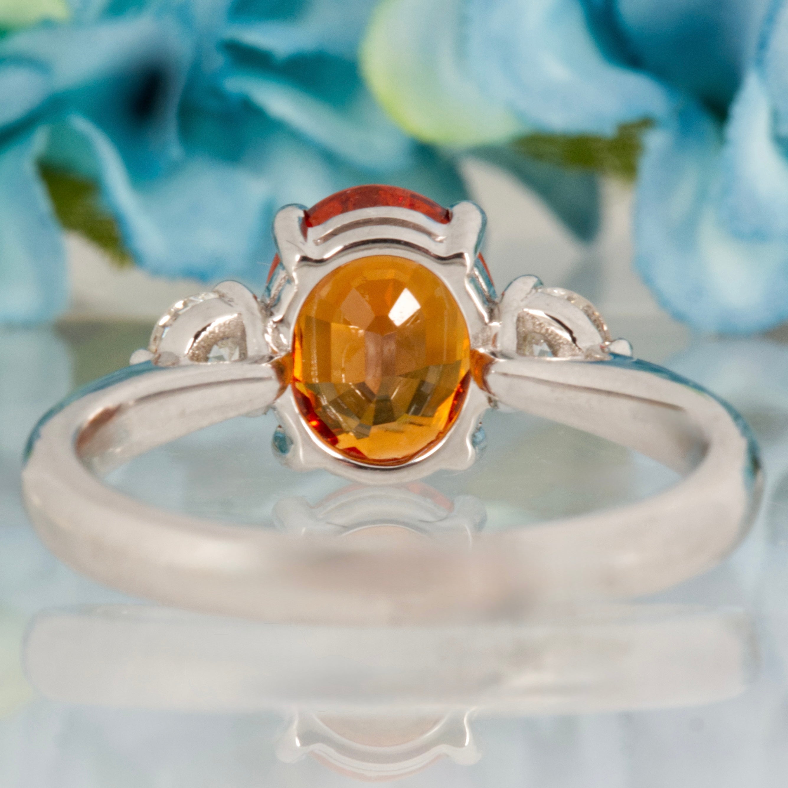 Platinum Oval Cut Mandarin Garnet & Round Brilliant Cut Diamond Trilogy Ring