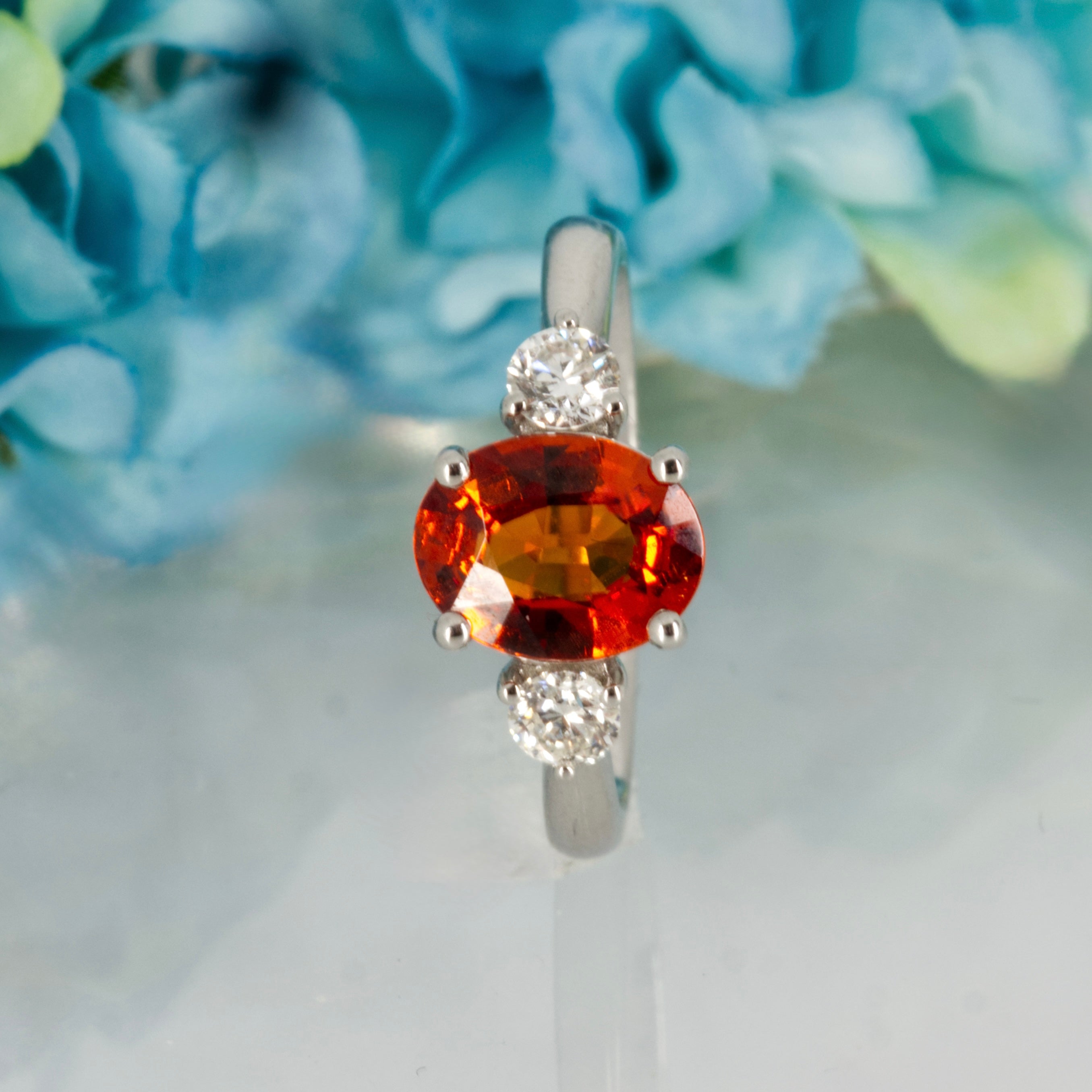 Platinum Oval Cut Mandarin Garnet & Round Brilliant Cut Diamond Trilogy Ring