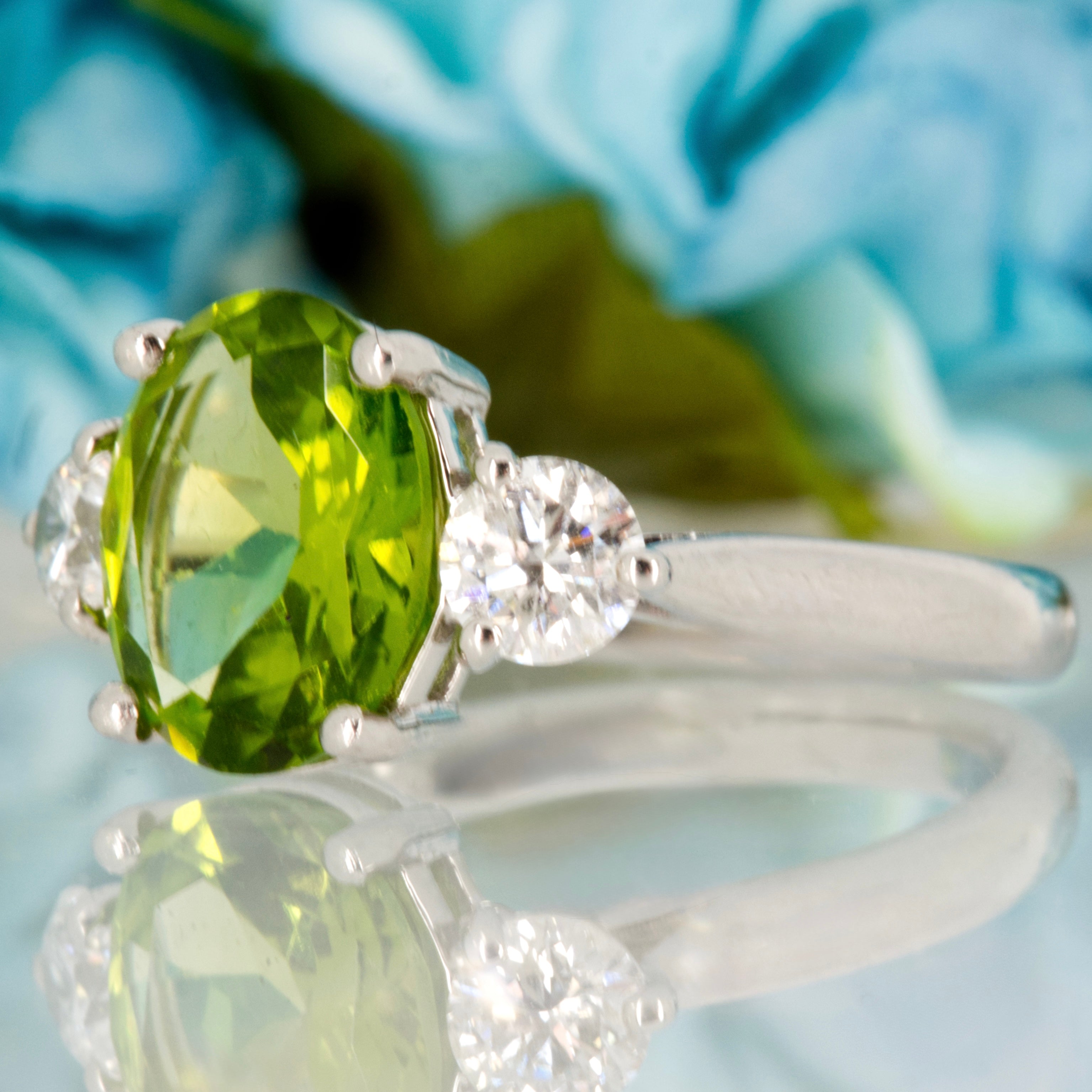 Platinum Oval Cut Peridot & Round Brilliant Cut Diamond Trilogy Ring