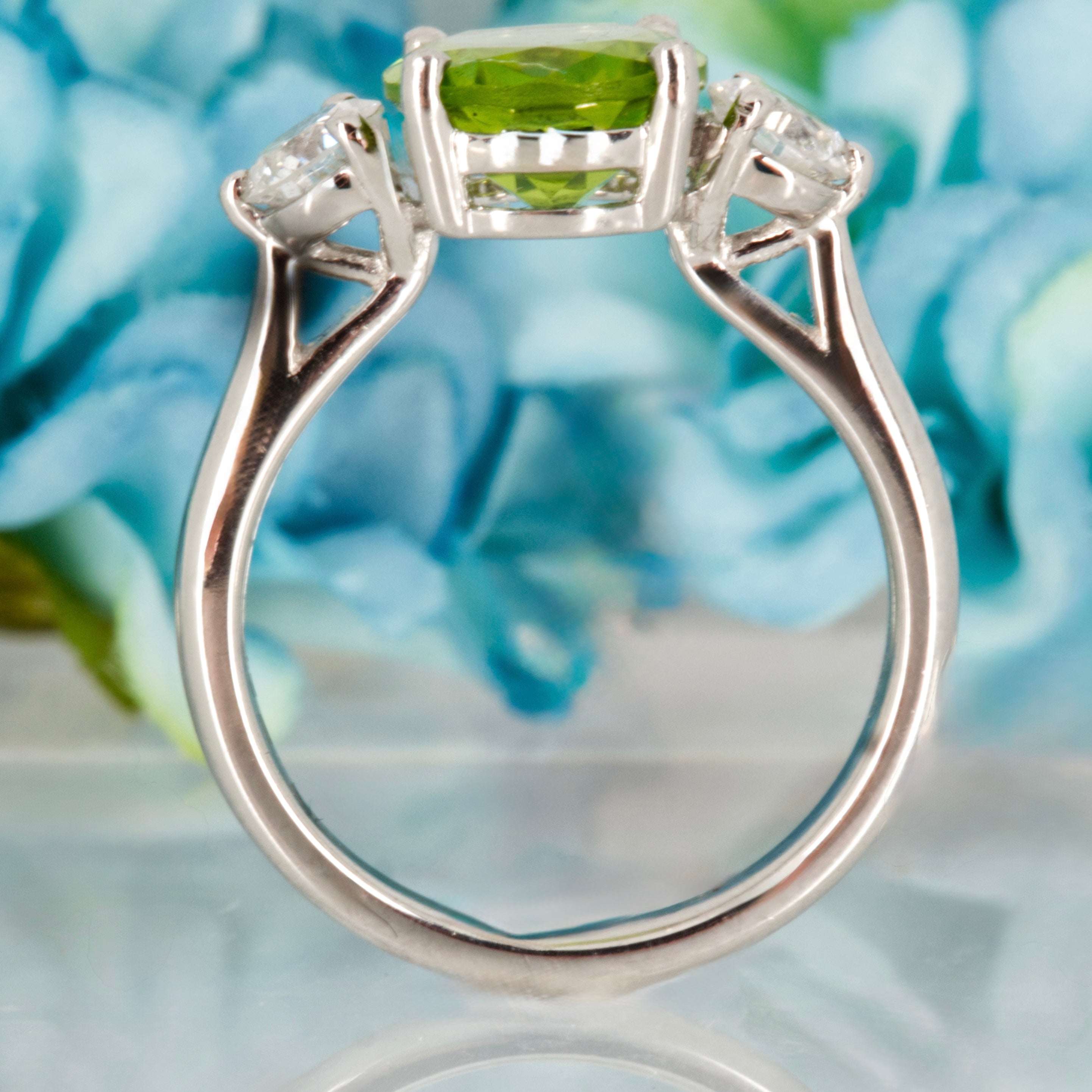 Platinum Oval Cut Peridot & Round Brilliant Cut Diamond Trilogy Ring