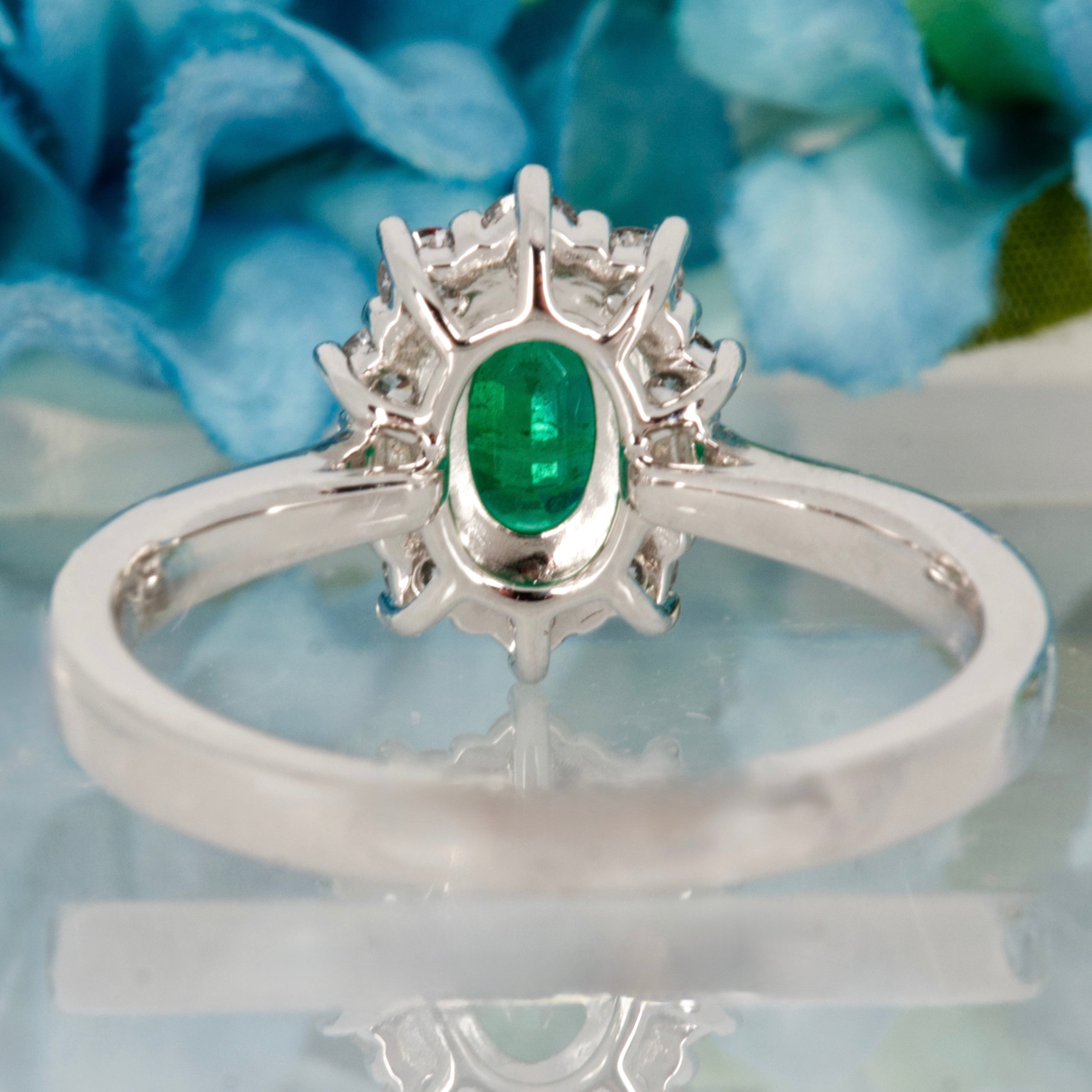 Platinum Oval Cut Emerald & Round Brilliant Cut Diamond Cluster Ring