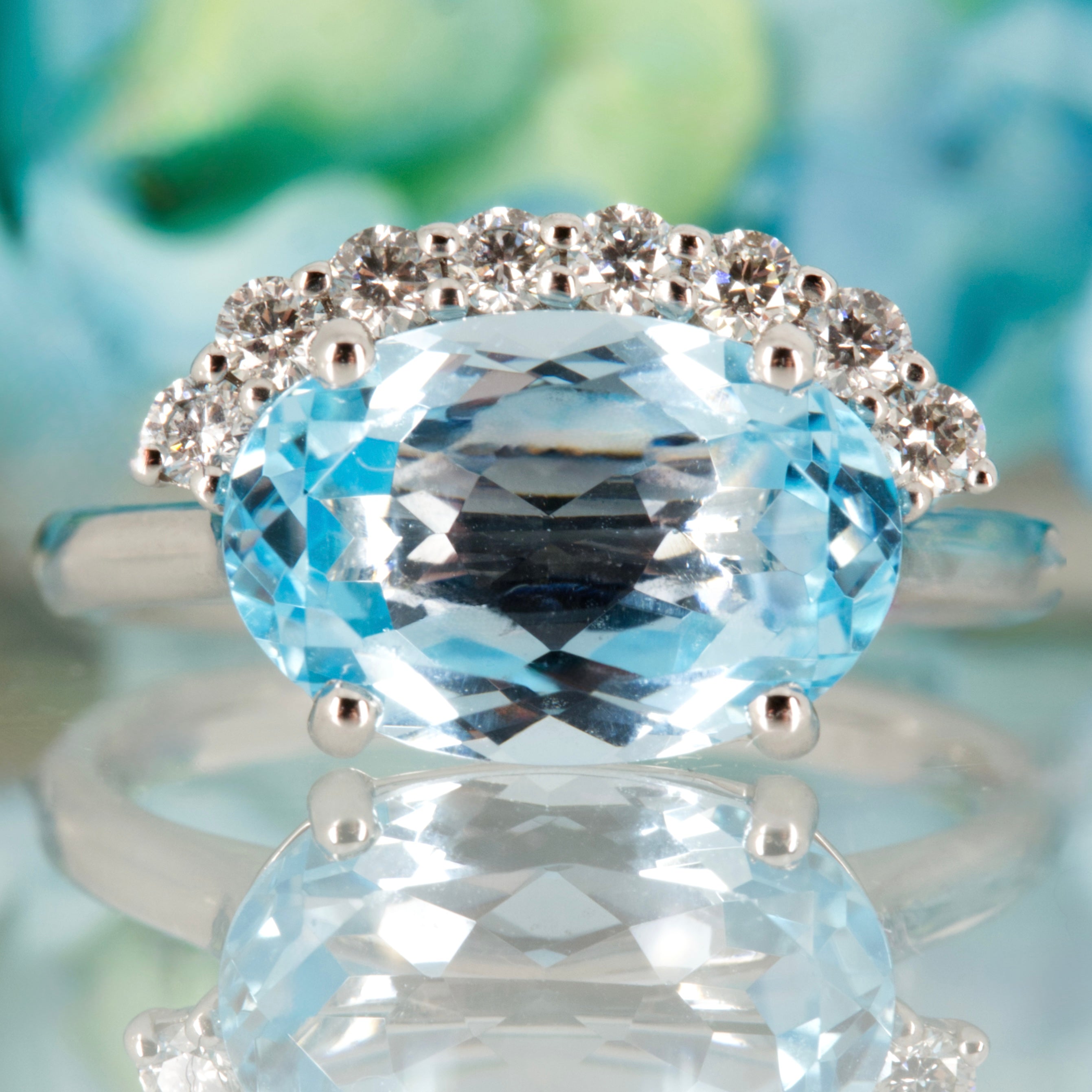 9ct White Gold Oval Cut Blue Topaz & Round Brilliant Cut Diamond Dress Ring