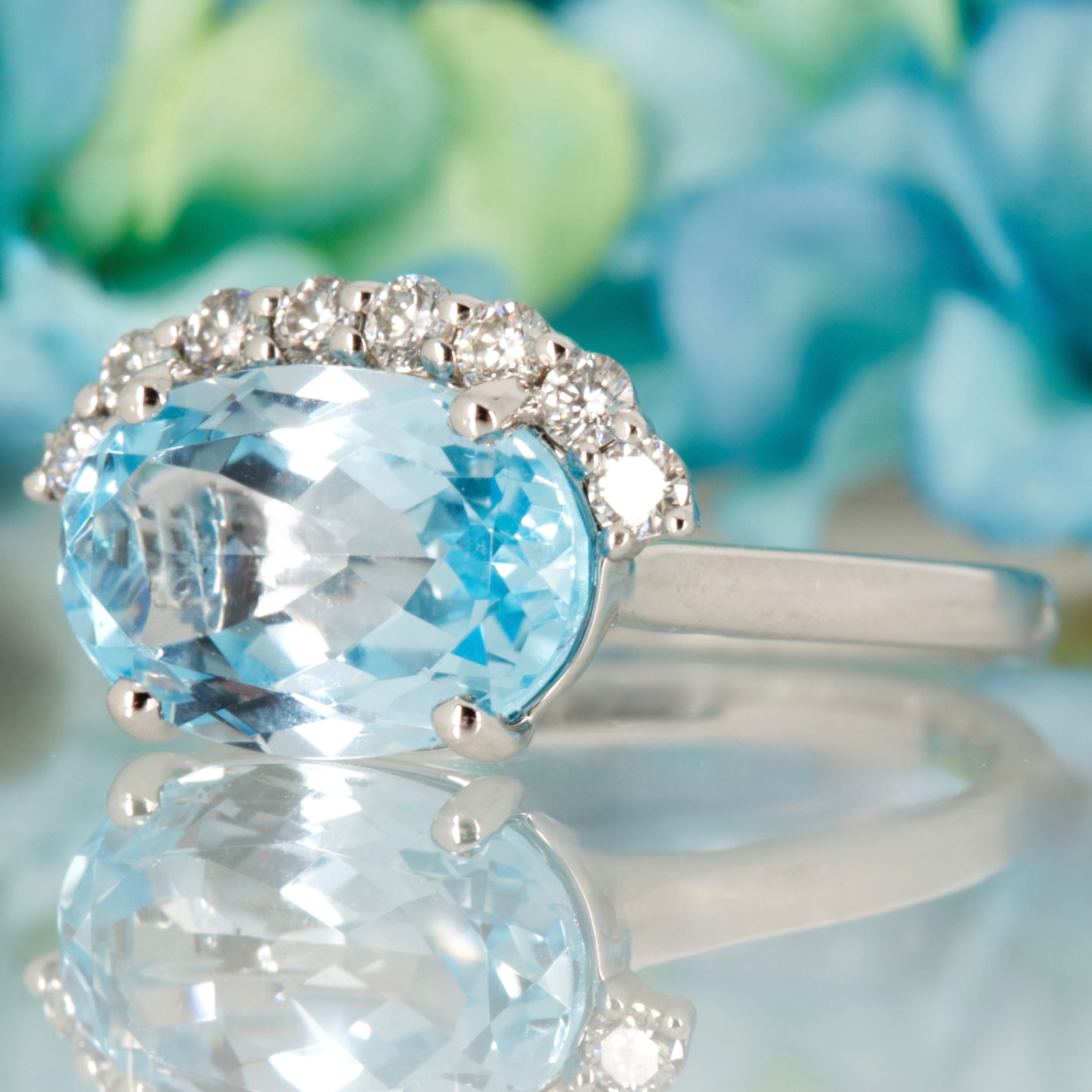 9ct White Gold Oval Cut Blue Topaz & Round Brilliant Cut Diamond Dress Ring