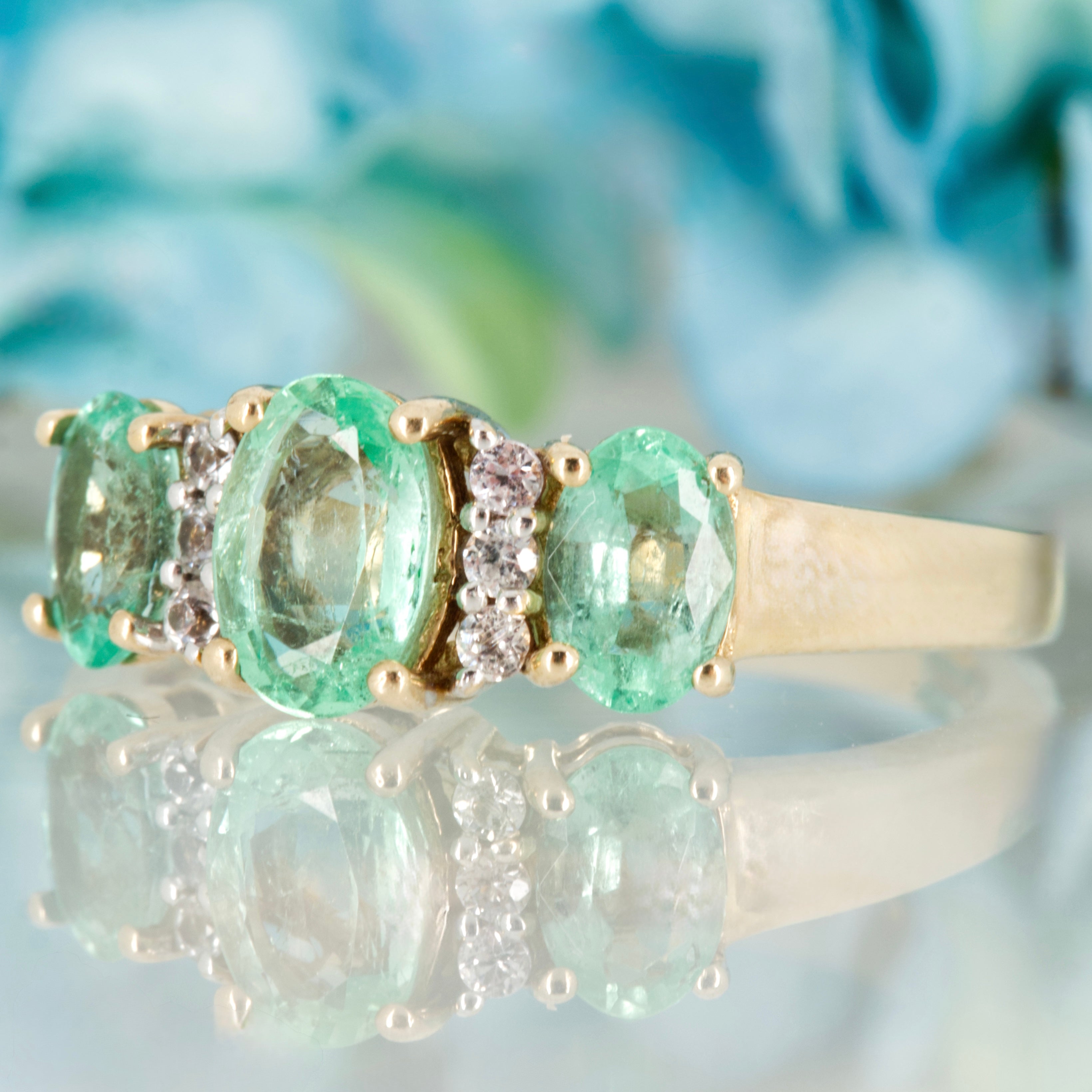 Pre-Loved 9ct Yellow Gold Oval Cut Emerald & Round Cut White Stone Dress Ring