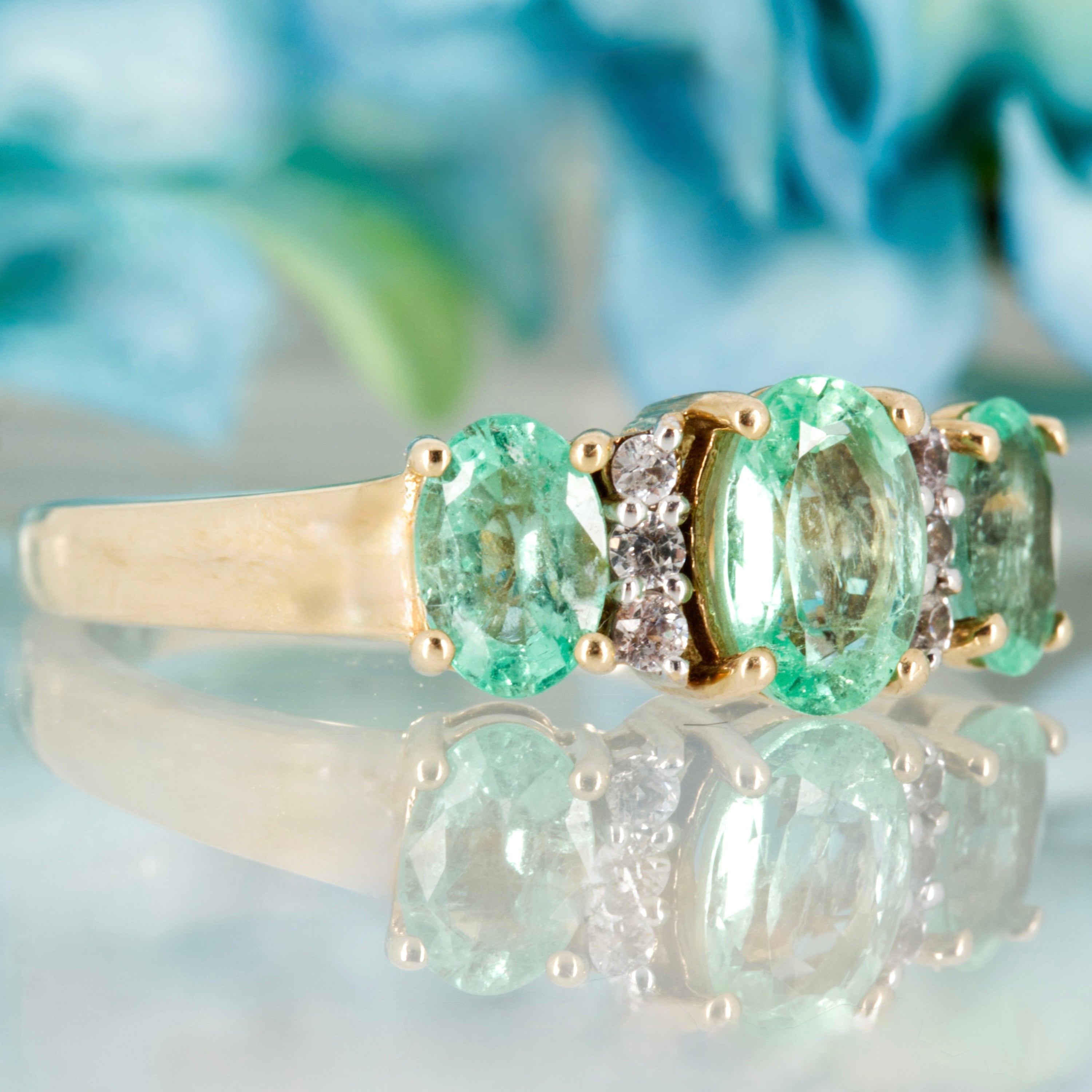 Pre-Loved 9ct Yellow Gold Oval Cut Emerald & Round Cut White Stone Dress Ring