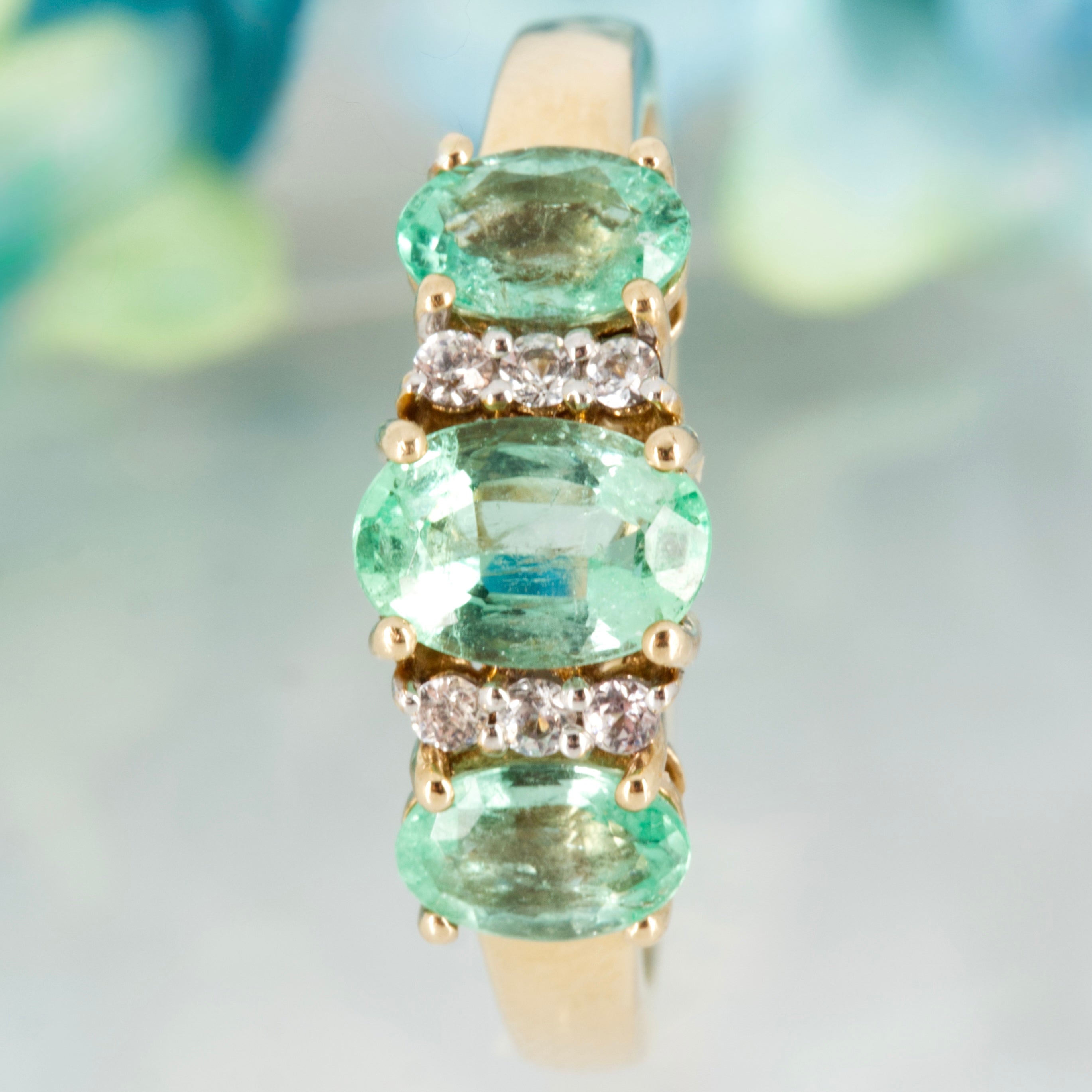 Pre-Loved 9ct Yellow Gold Oval Cut Emerald & Round Cut White Stone Dress Ring