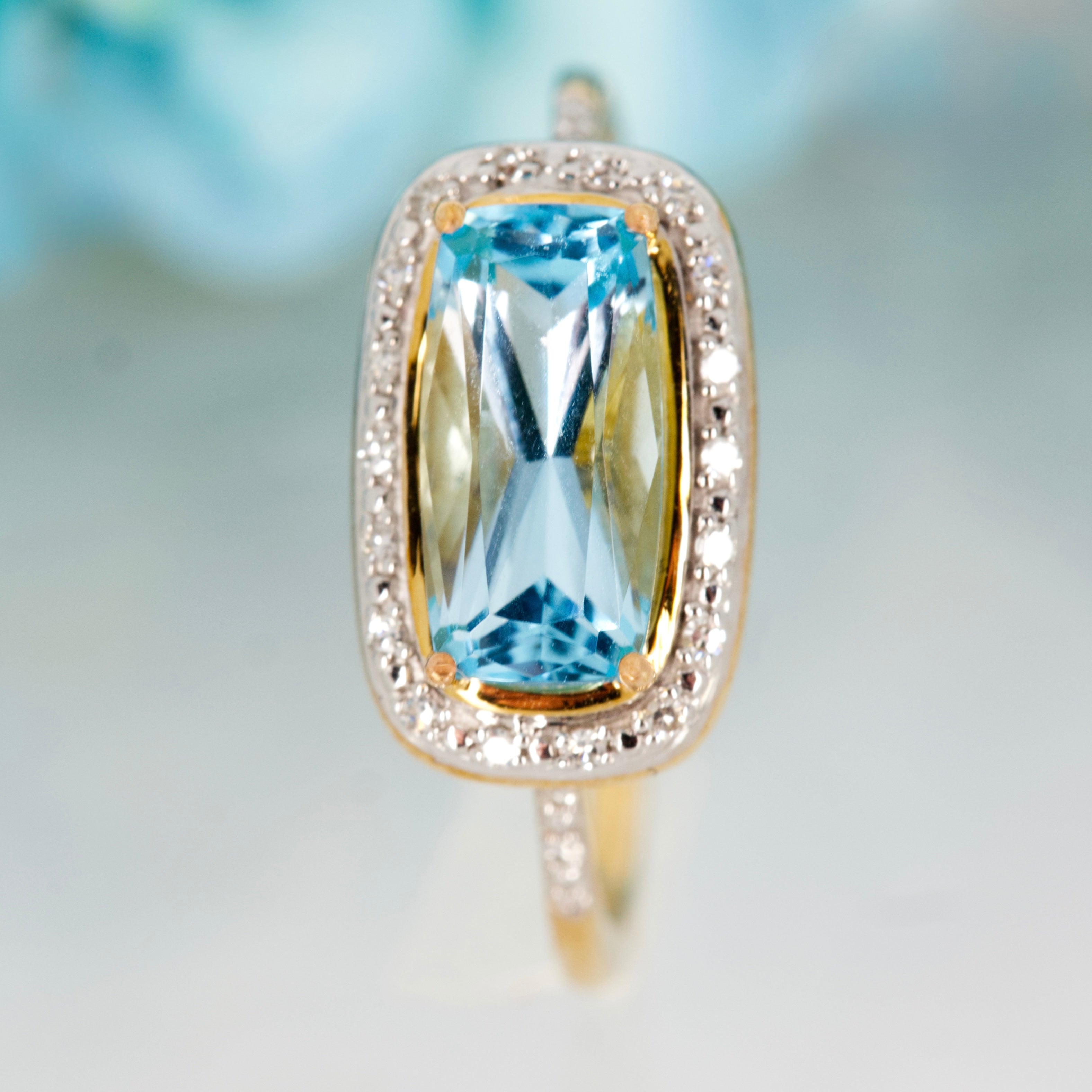 9ct Yellow Gold Rectangular Cut Blue Topaz & Round Brilliant Cut Diamond Halo Cluster Ring