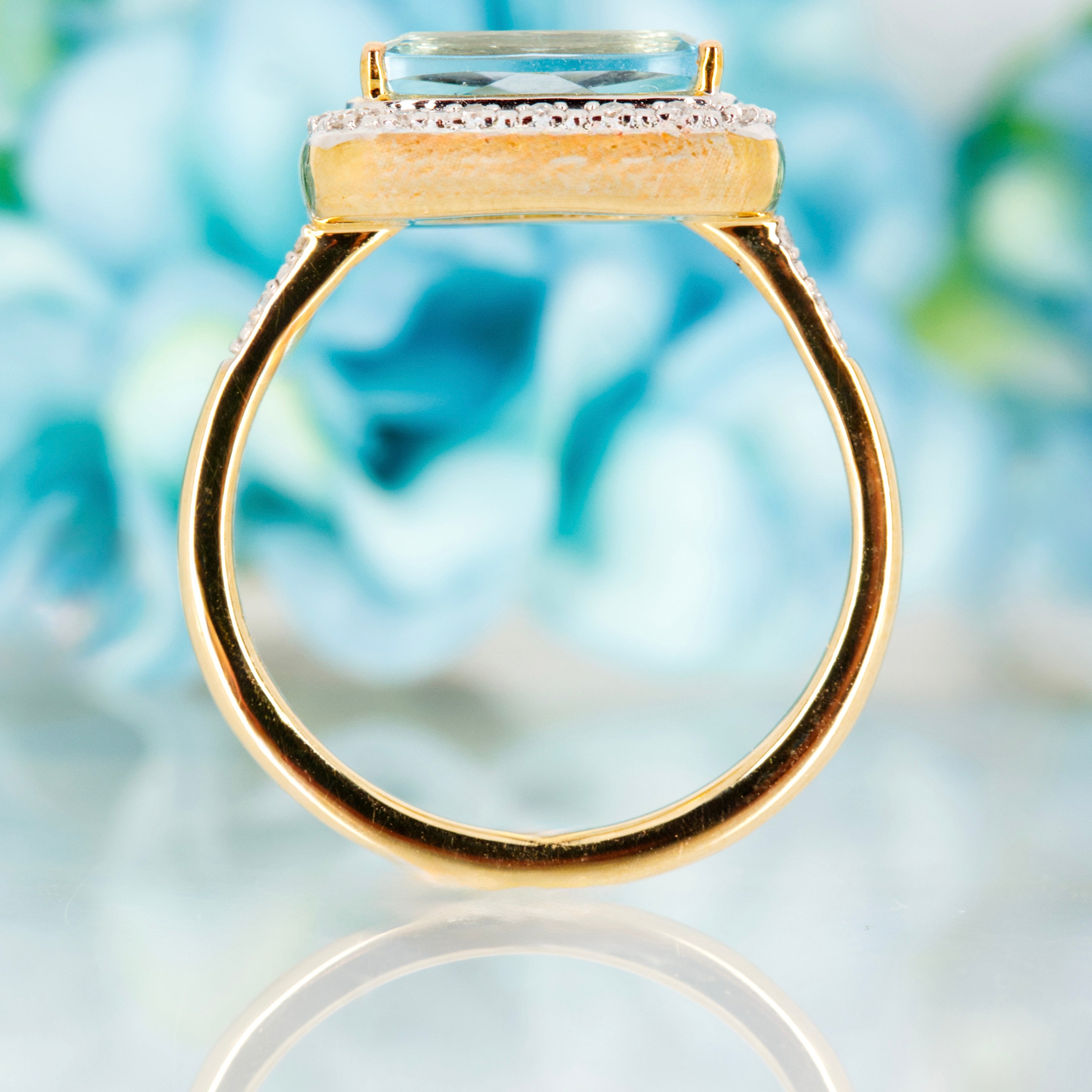 9ct Yellow Gold Rectangular Cut Blue Topaz & Round Brilliant Cut Diamond Halo Cluster Ring