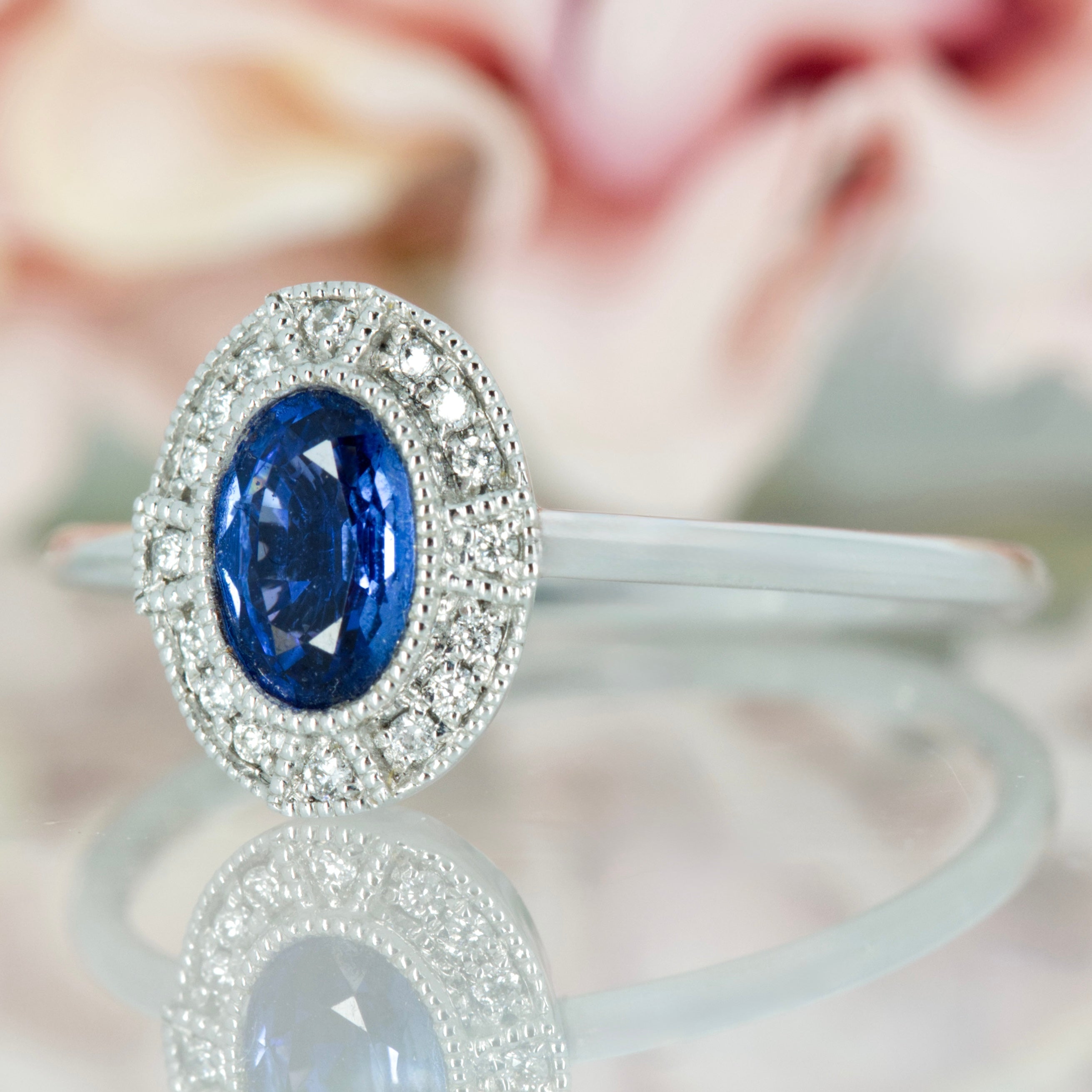 18ct White Gold Oval Cut Sapphire & Round Brilliiant Cut Diamond Halo Cluster Ring