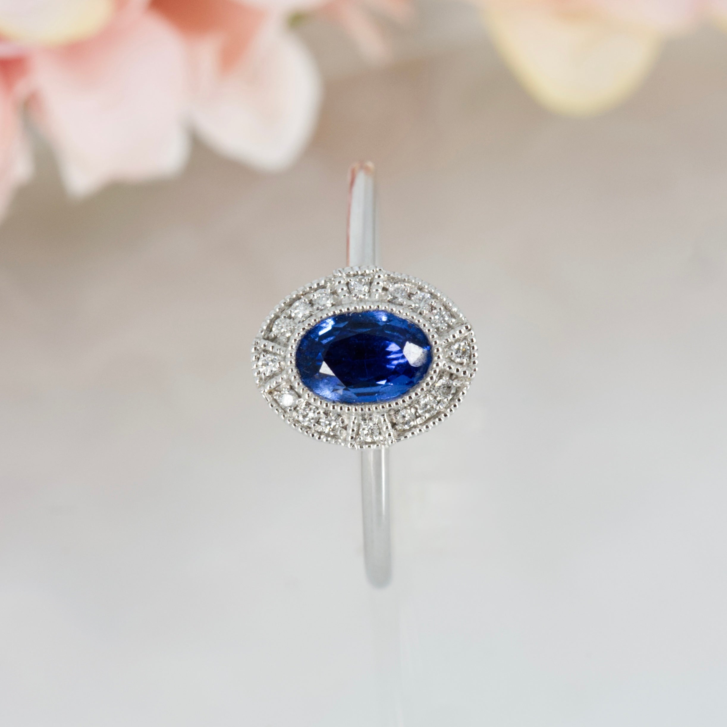 18ct White Gold Oval Cut Sapphire & Round Brilliiant Cut Diamond Halo Cluster Ring