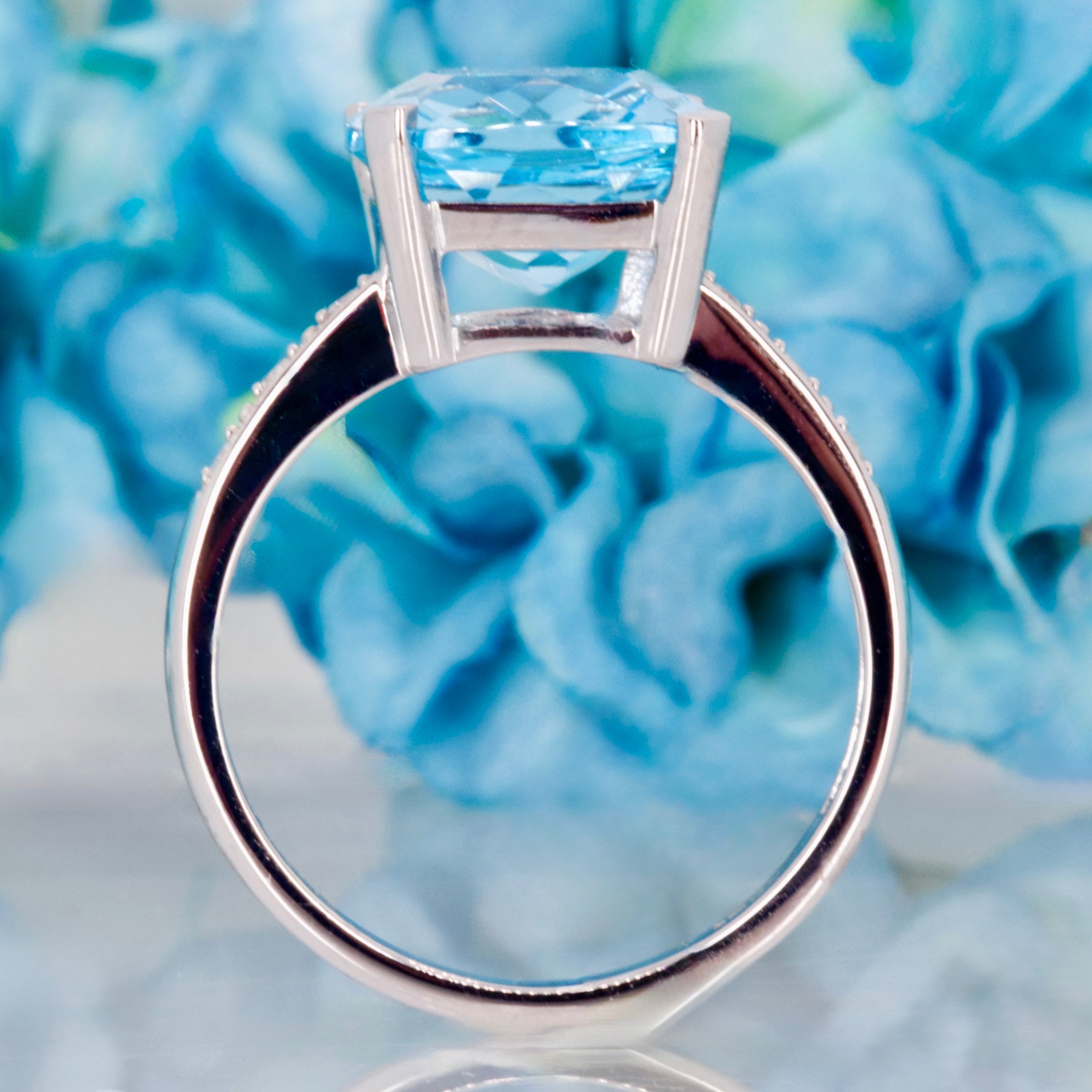 9ct White Gold Elongated Cushion Cut Blue Topaz & Round Brilliant Cut Diamond Ring
