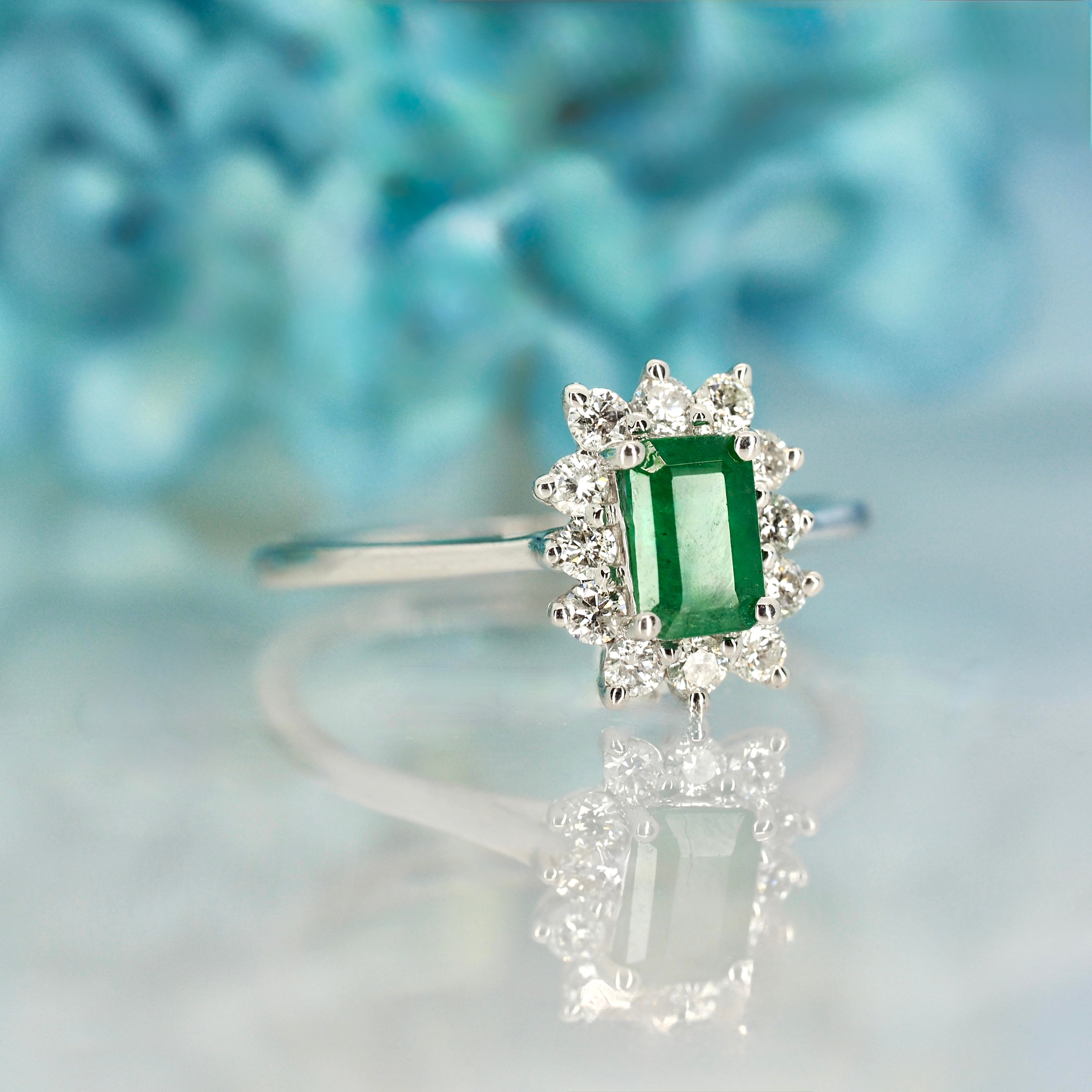 Platinum Rectangular Cut Emerald & Round Brilliant Cut Diamond Cluster Ring