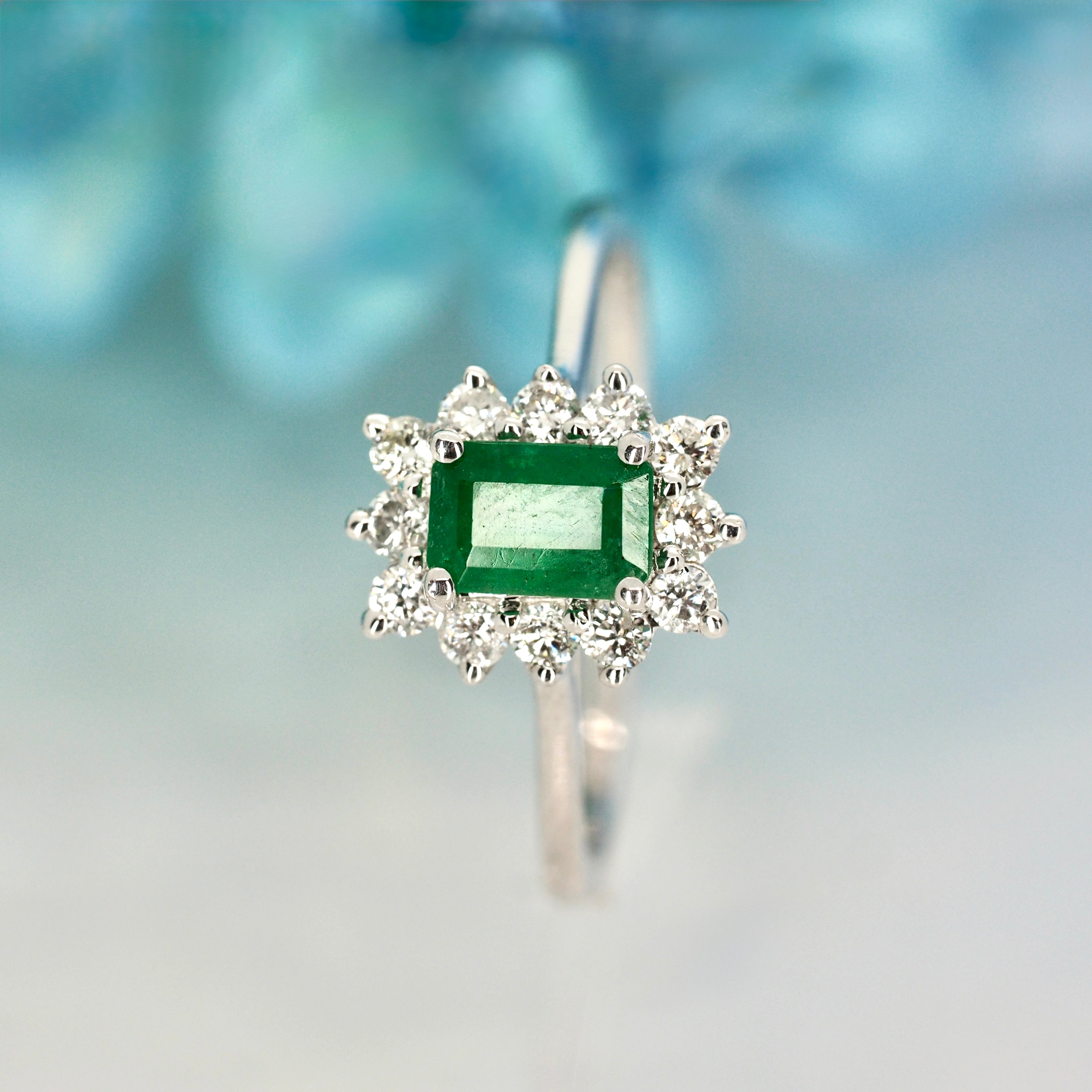Platinum Rectangular Cut Emerald & Round Brilliant Cut Diamond Cluster Ring