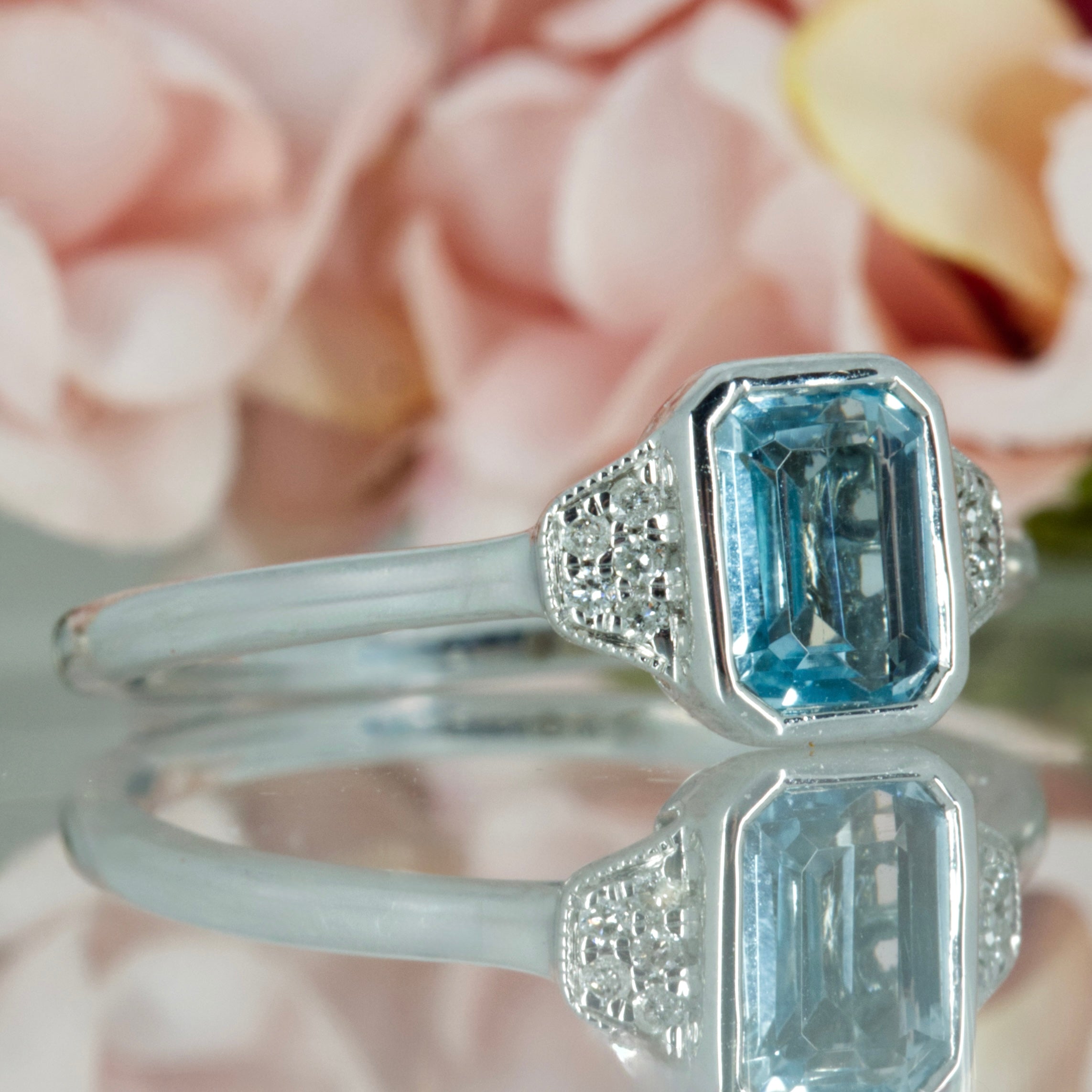 9ct White Gold Octagonal Cut Blue Topaz & Round Brilliant Cut Diamond Ring