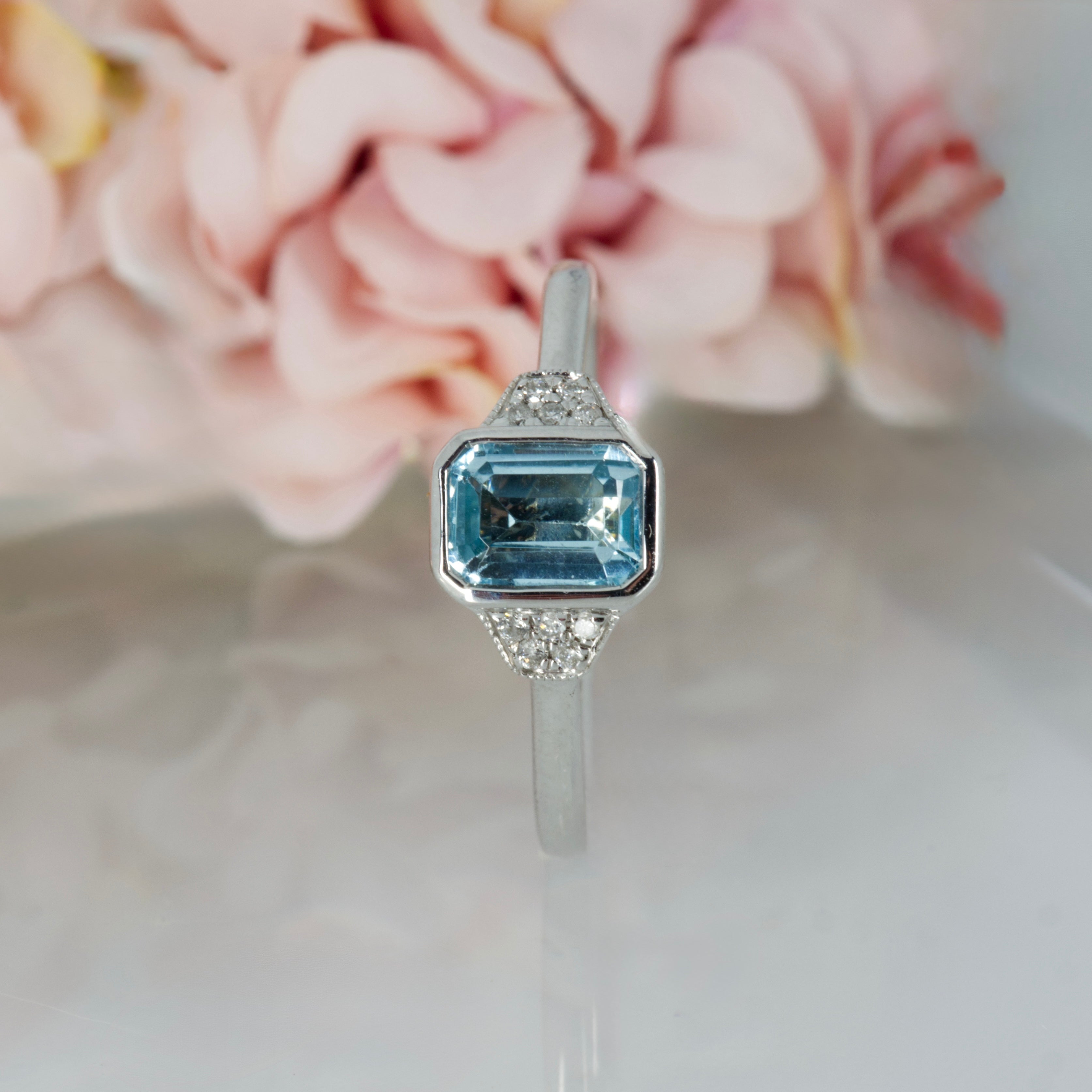 9ct White Gold Octagonal Cut Blue Topaz & Round Brilliant Cut Diamond Ring