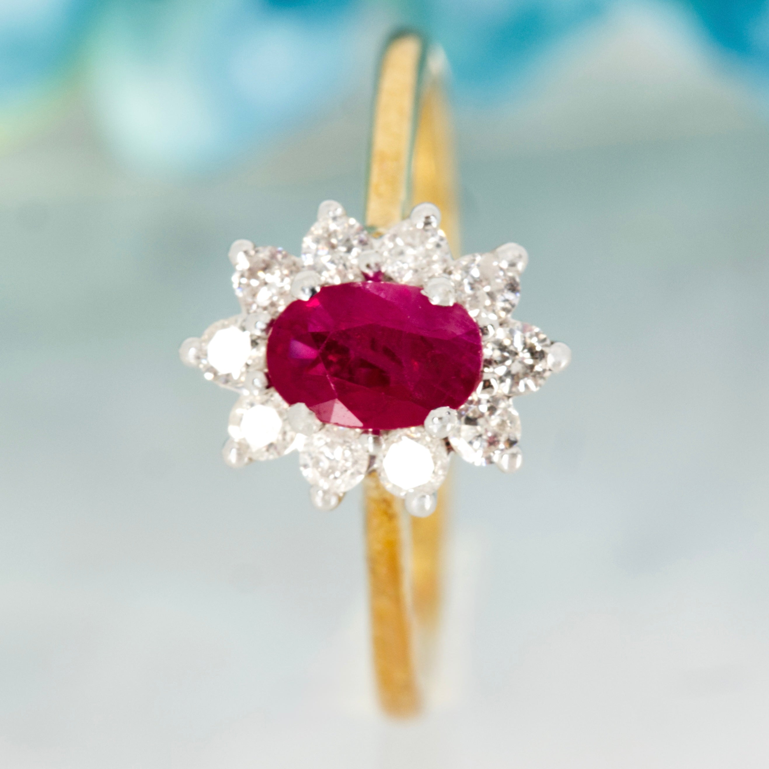 9ct Yellow Gold Oval Cut Ruby & Round Brilliant Cut Diamond Cluster Ring