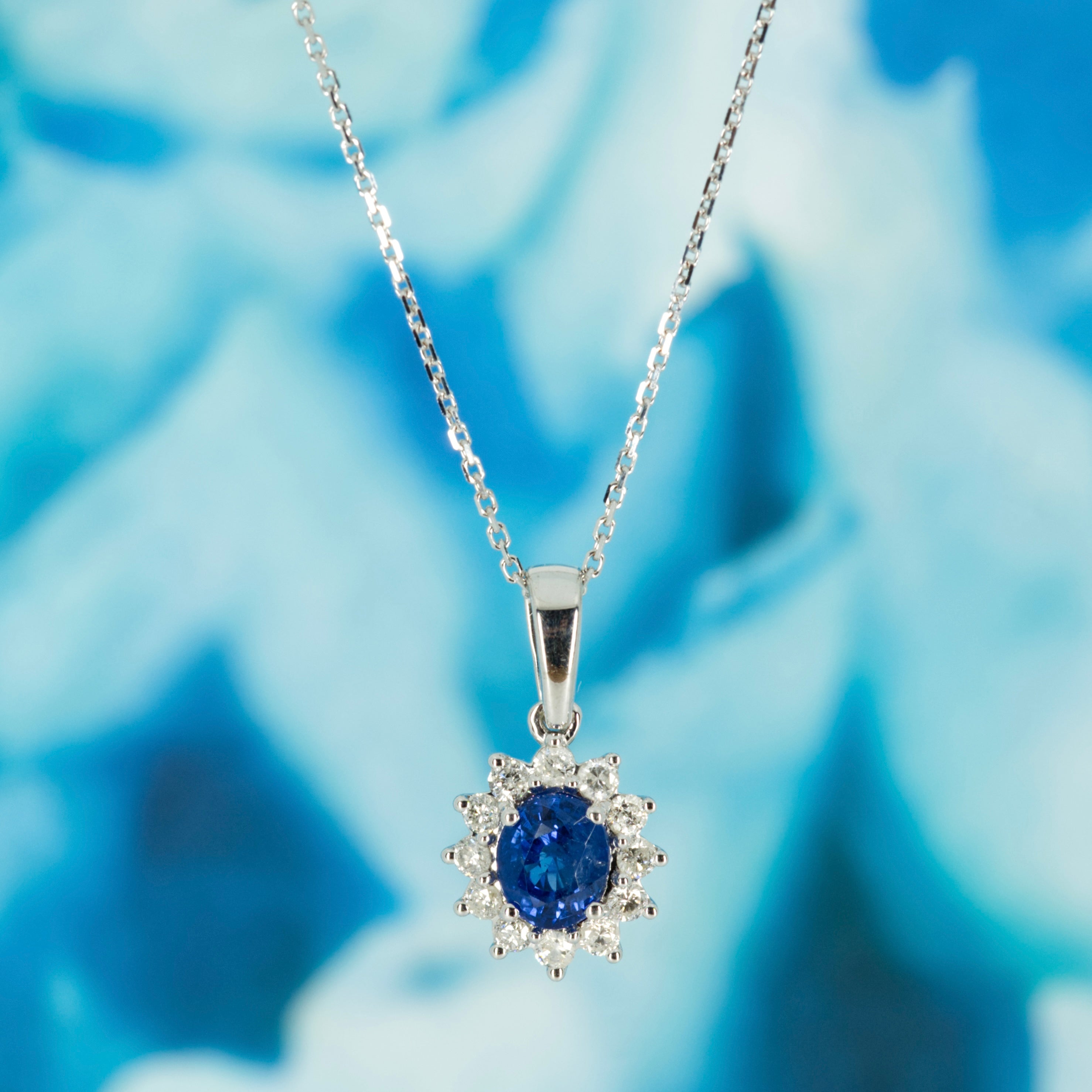 9ct White Gold Oval Cut Sapphire & Round Brilliant Cut Diamond Cluster Pendant & Chain