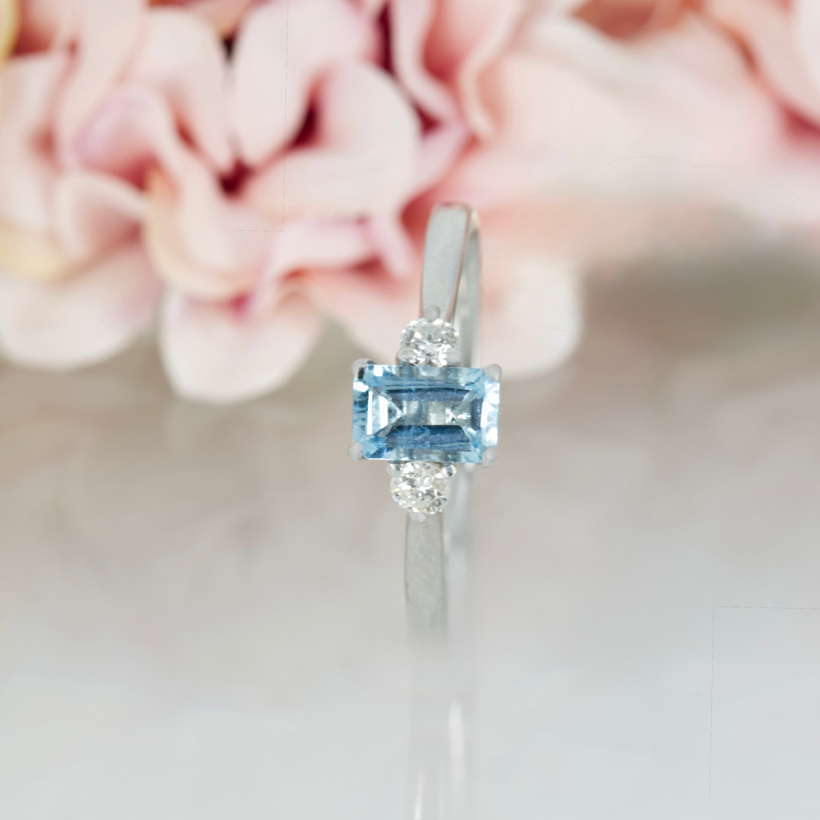 Platinum Octagonal Cut Aquamarine & Round Brilliant Cut Diamond Trilogy Ring