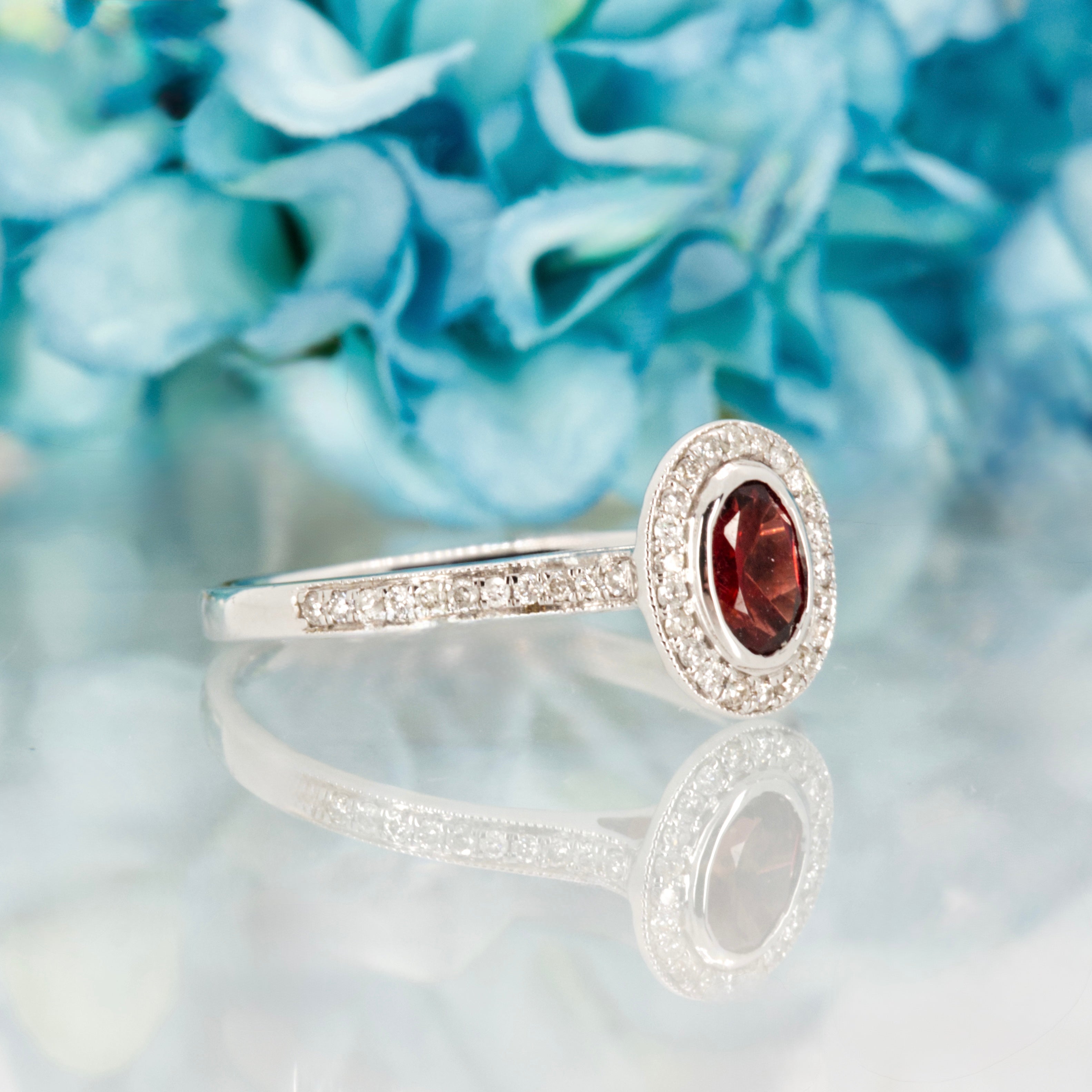 18ct White Gold Oval Cut Garnet & Round Brilliant Cut Diamond Halo Cluster Ring