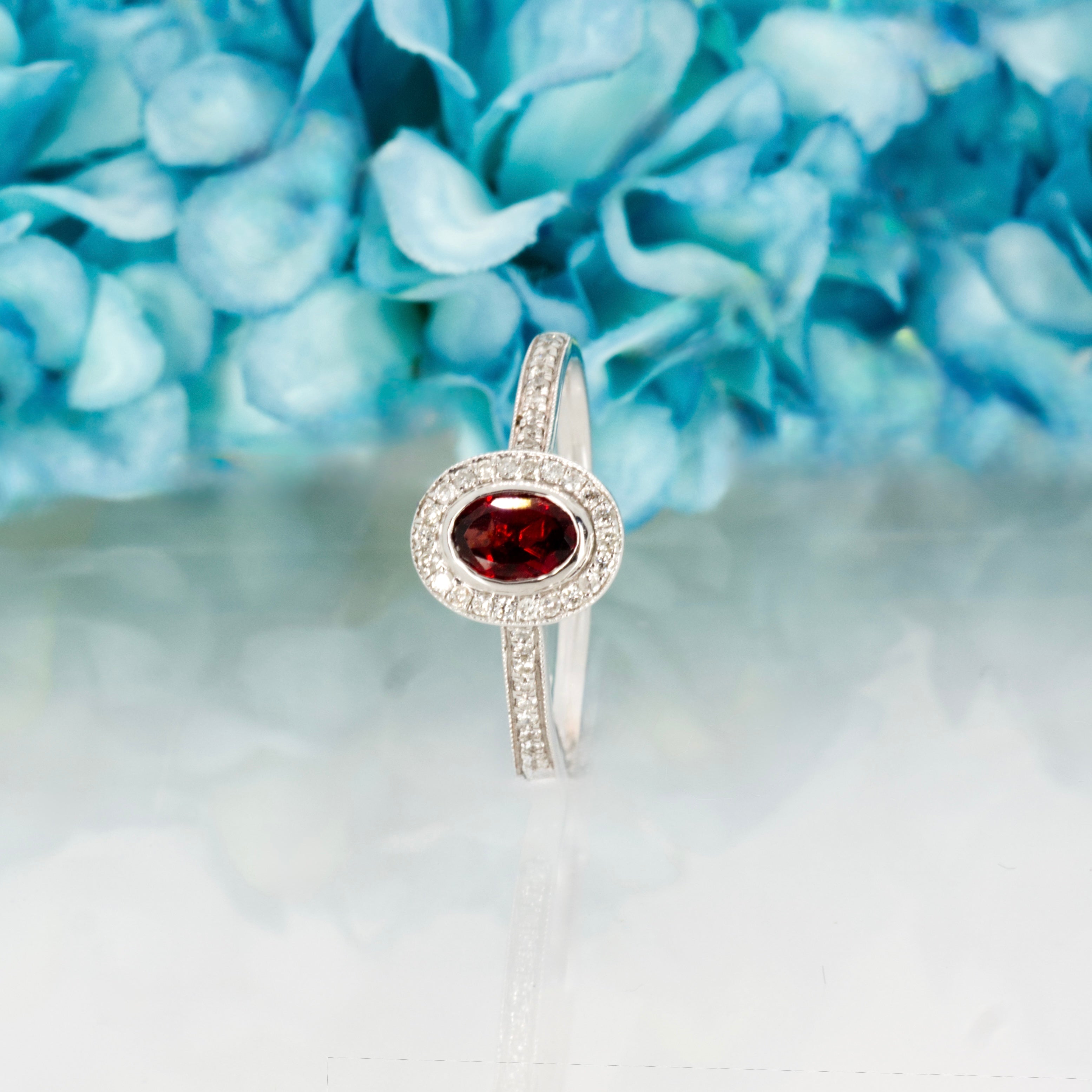 18ct White Gold Oval Cut Garnet & Round Brilliant Cut Diamond Halo Cluster Ring
