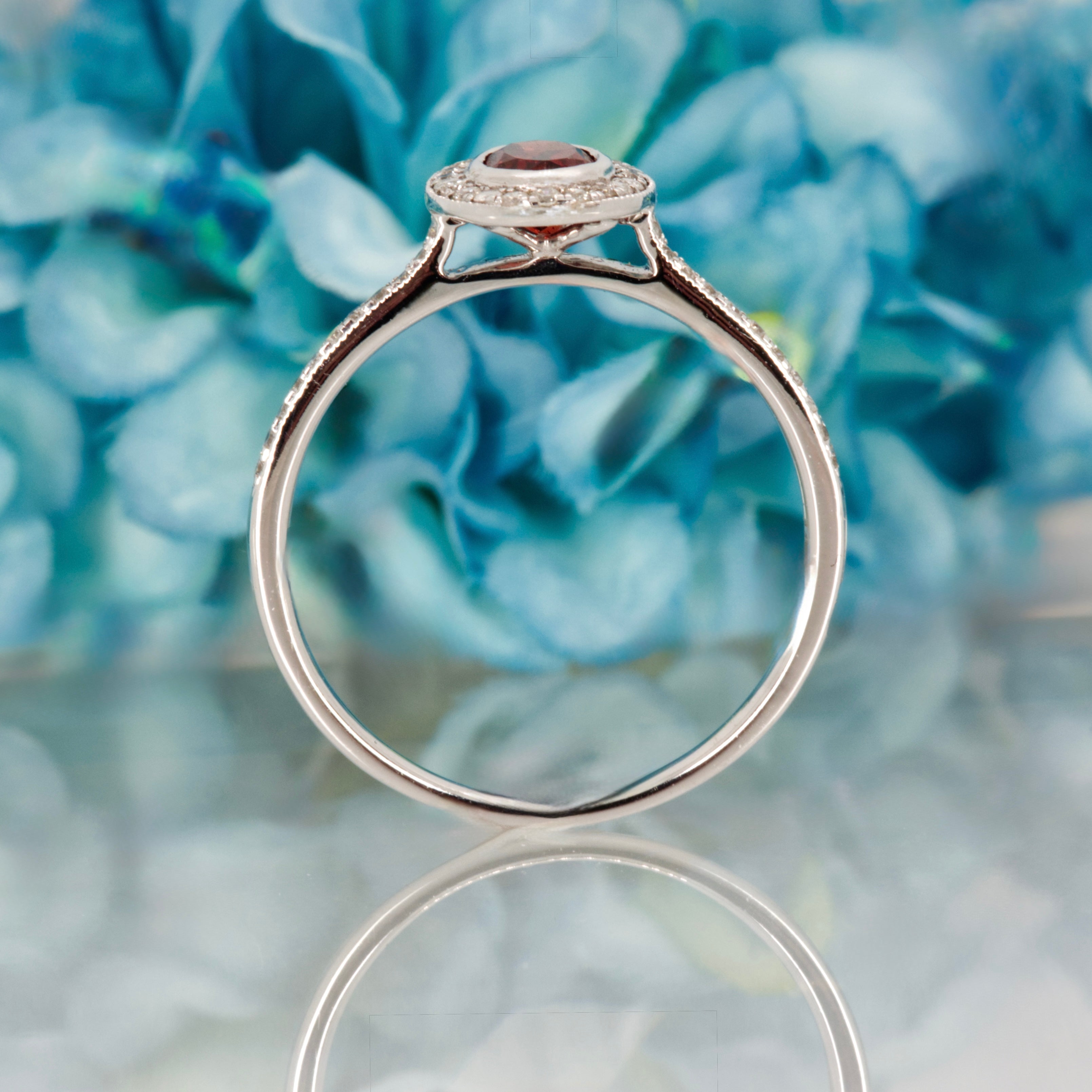 18ct White Gold Oval Cut Garnet & Round Brilliant Cut Diamond Halo Cluster Ring
