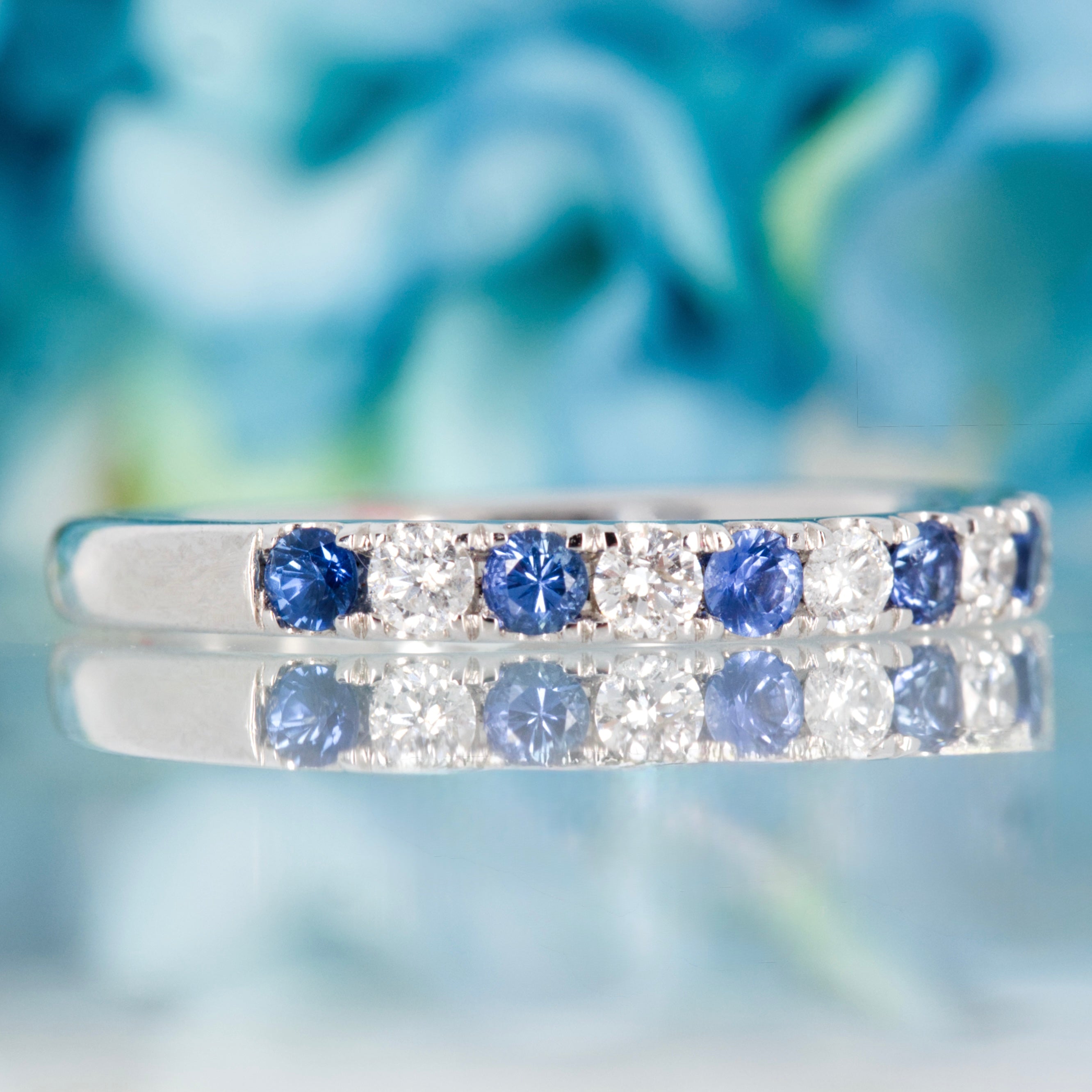 Platinum Round Cut Sapphire & Diamond Claw Set Half Eternity Ring
