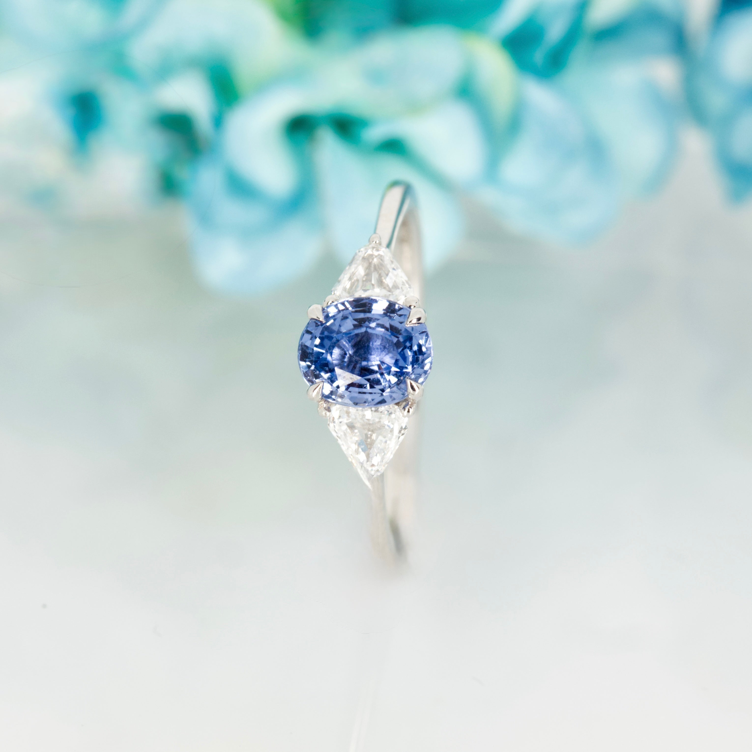 Platinum Oval Cut Sapphire & Trilliant Cut Diamond Trilogy Ring